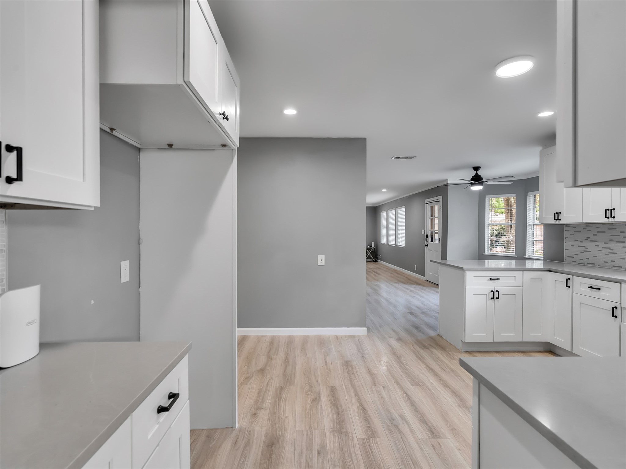 Kitchen flows into breakfast eating or dining area.