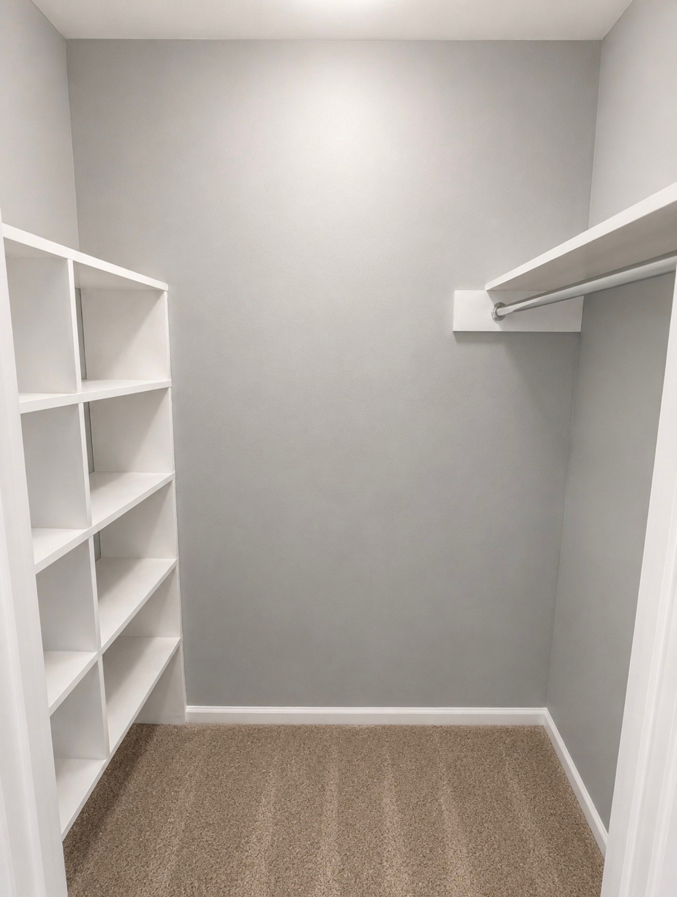 Large walk in closet with shelf storage bedroom in bedroom one.