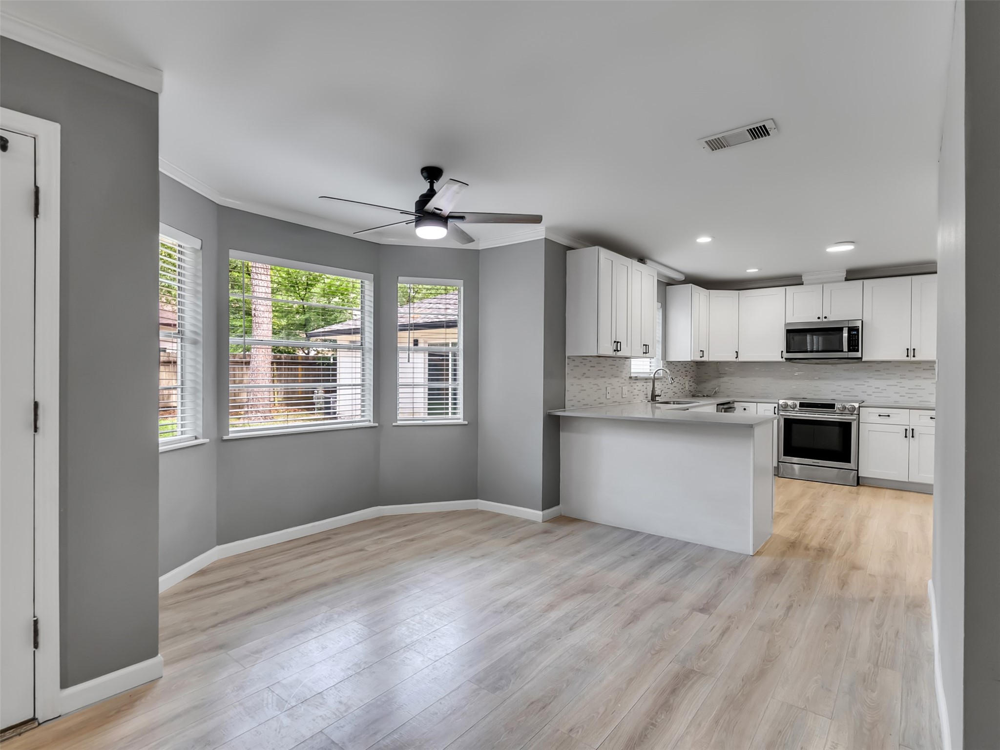 Direct access to the backyard from the kitchen make entertaining in this home a breeze.
