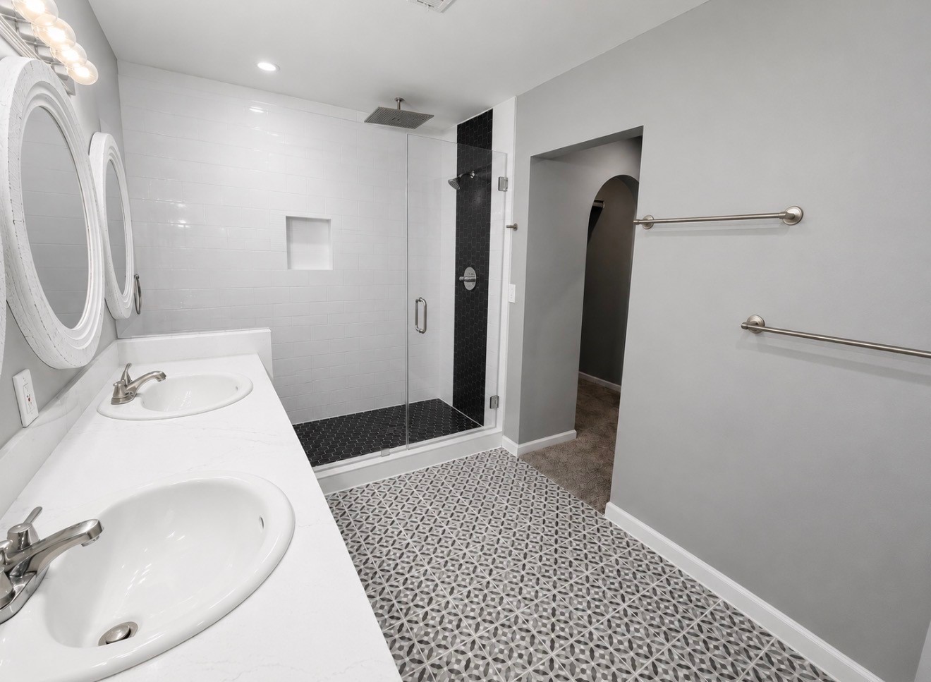 Large super shower with dual rain and massaging shower heads.
