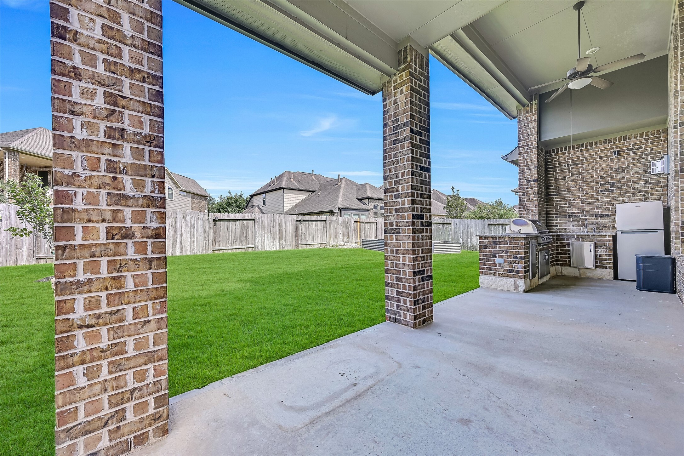 Extend your living space outdoors beneath the expansive covered patio, complete with a ceiling fan and plenty of room for relaxing or dining al fresco. Whether enjoying a quiet morning coffee or gathering with friends, this inviting outdoor space is designed for year-round enjoyment.