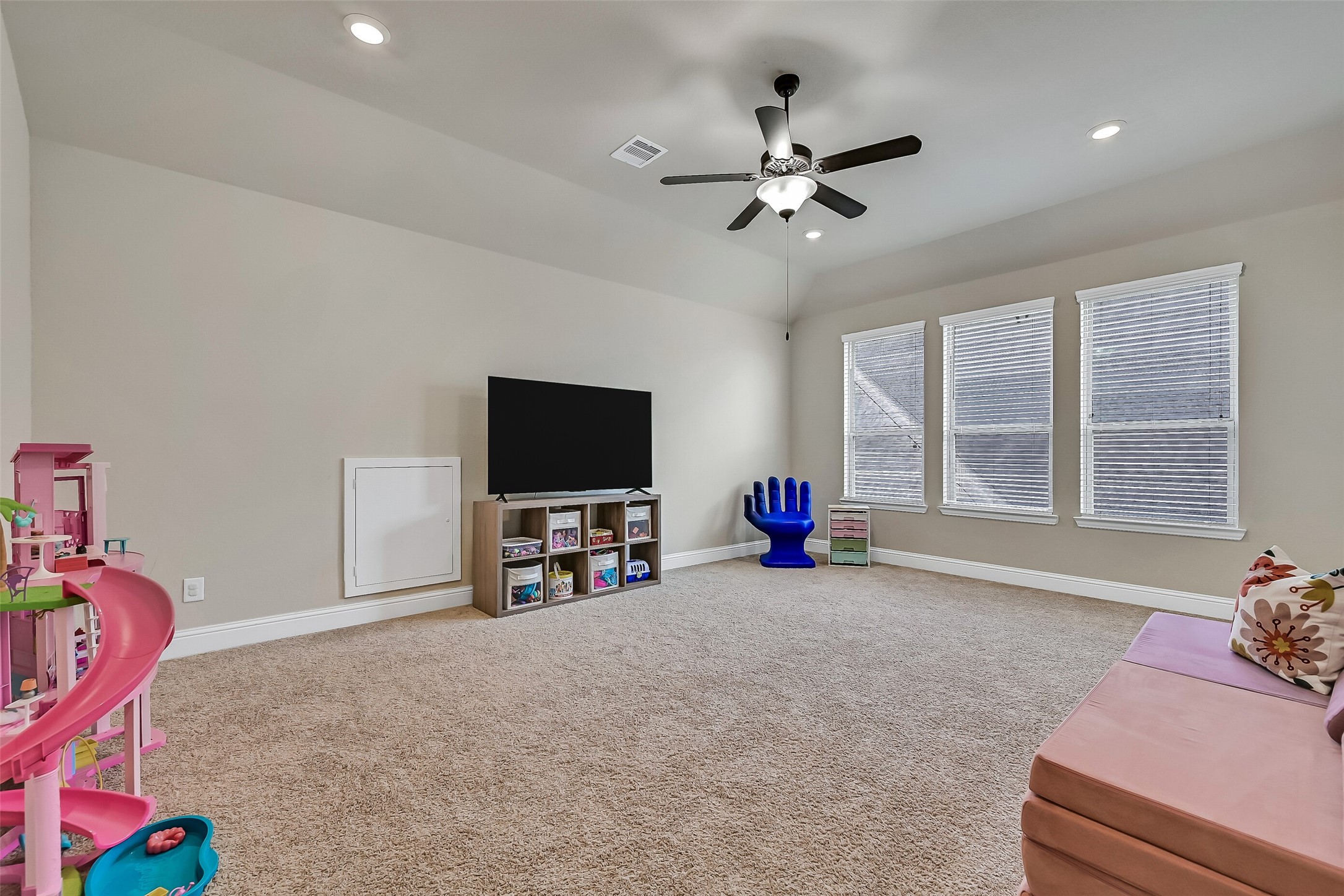 Three large windows fill the game room with natural light while the generous layout offers endless flexibility for every stage of life. Whether it's a children's playroom today or a media room tomorrow, this versatile space easily adapts to your family's changing needs.