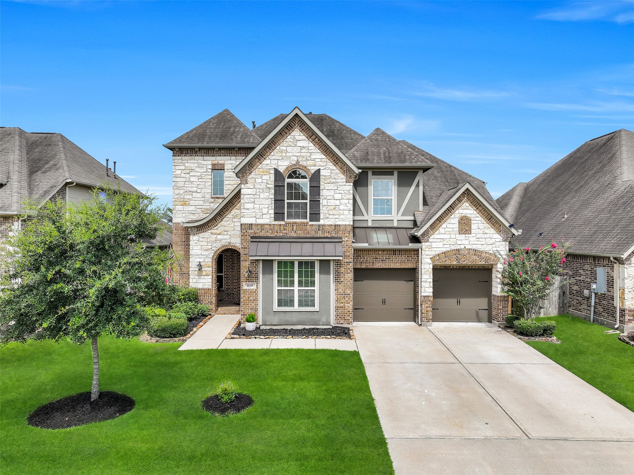 From every angle, this beautifully maintained home showcases timeless curb appeal with a striking blend of brick, stone, stucco, decorative wood accents, carriage-style garage doors, and professionally manicured landscaping maintained by a remote controlled sprinkler system. Nestled in sought-after West Ranch and zoned to Friendswood ISD, it's a home you'll be proud to come home to.