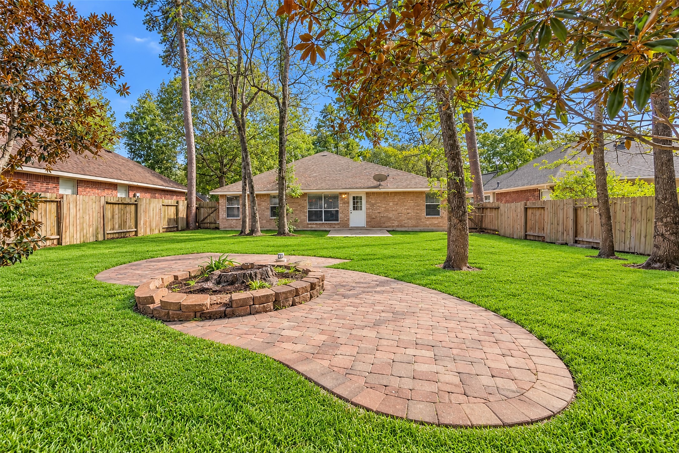 Spacious, fully fenced backyard perfect for outdoor entertaining and pets.  Grass enhanced.