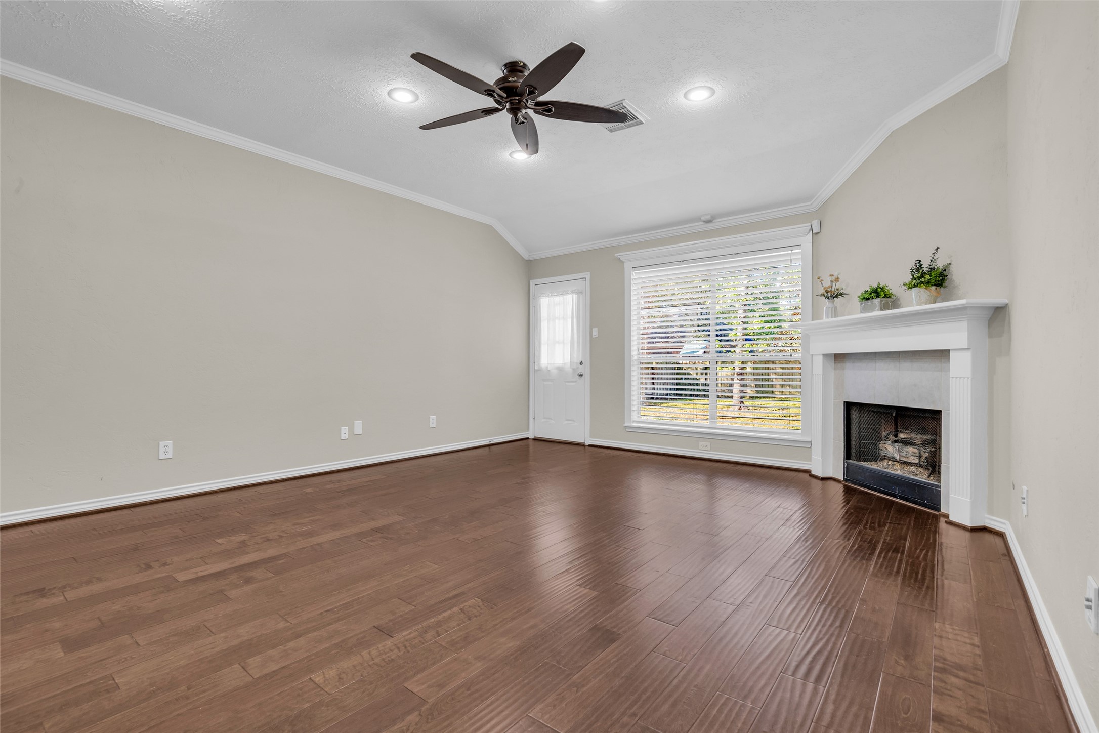 Exterior door leads to a large backyard. Notice the beautiful crown molding.