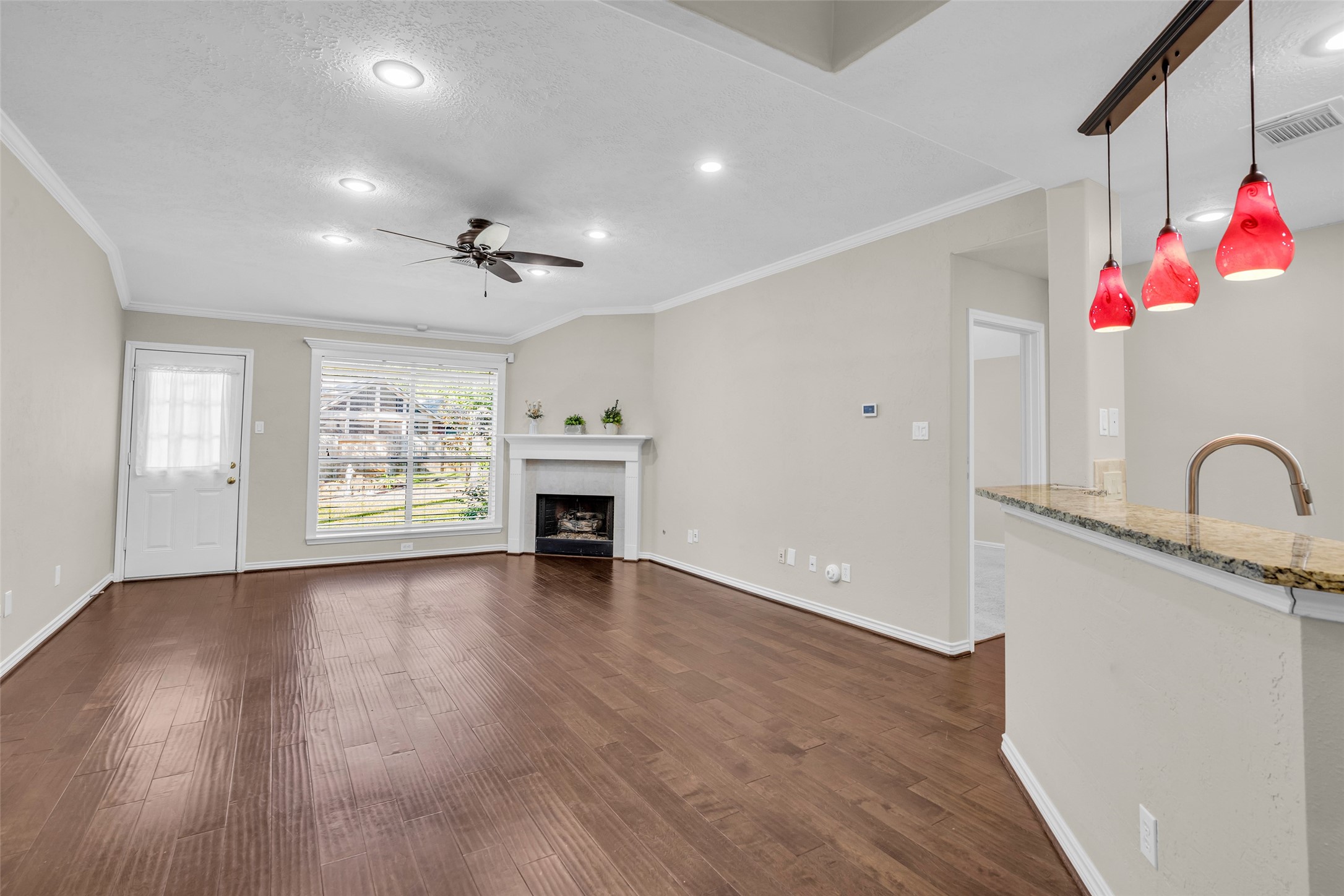 Gas fireplace.  Door to Primary Suite shown on the right side