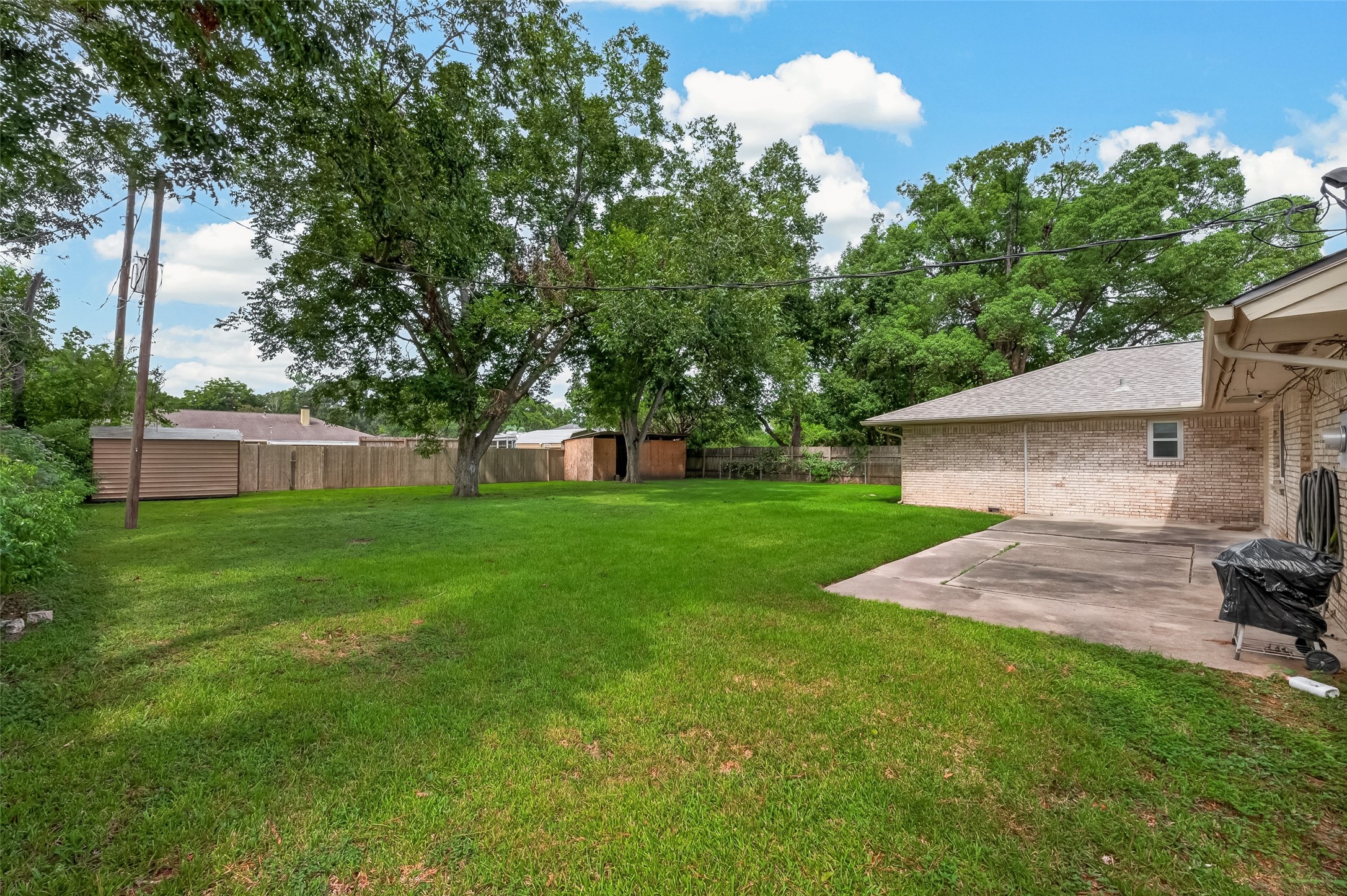 Large backyard with patio for entertaining