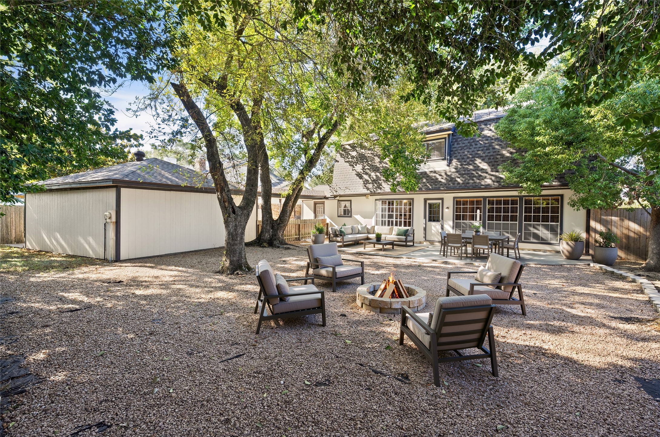 Large outdoor space virtually staged to show the options for having friends and family over for gatherings.