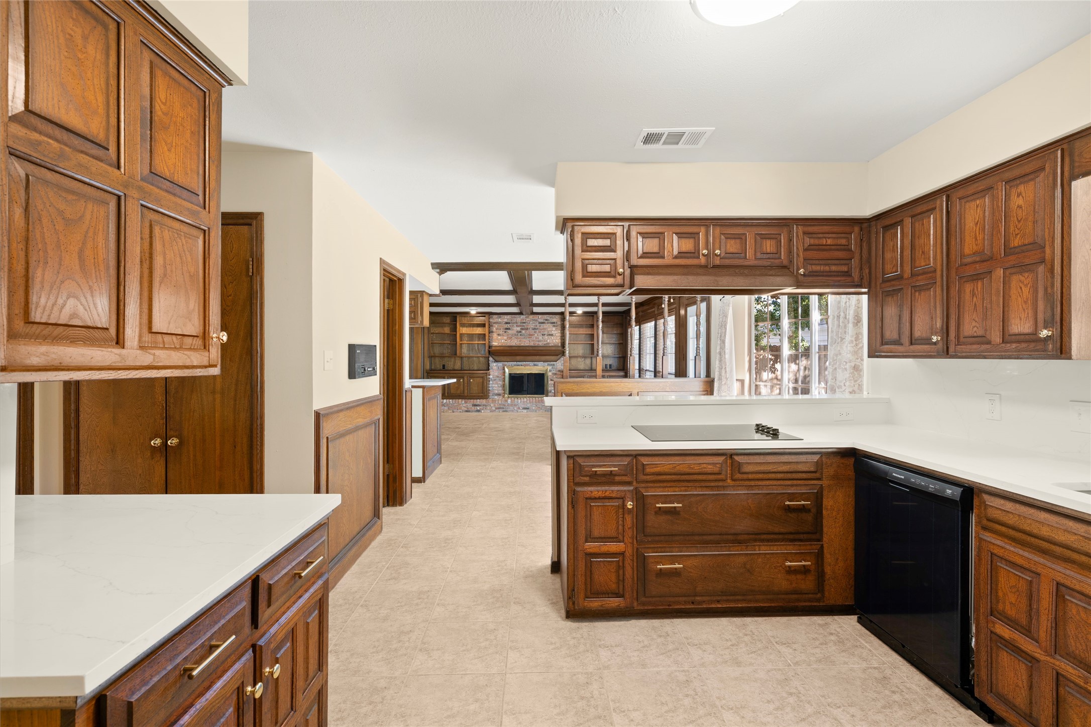 Beautiful rich wood cabinetry with contemporary hardware.
