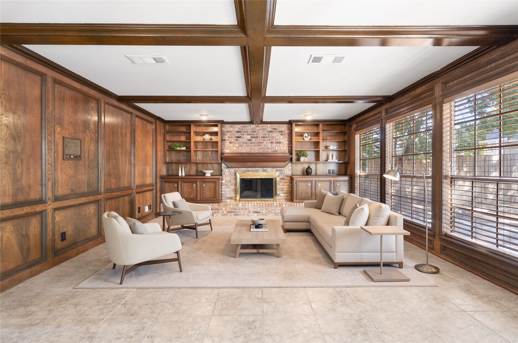 The family room is virtually staged to show the ample space providing room for larger furniture and furnishings.
