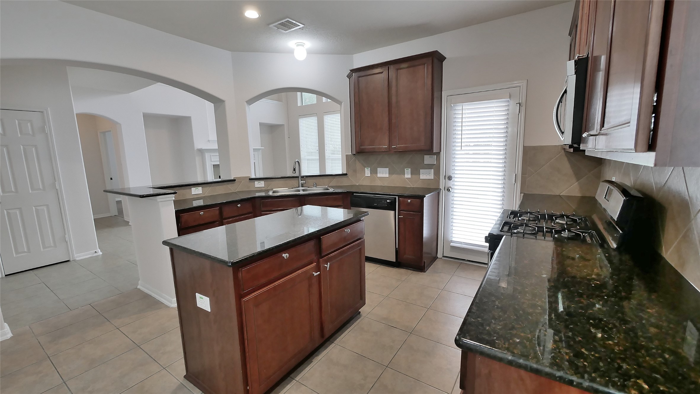 Kitchen looking into Family Room