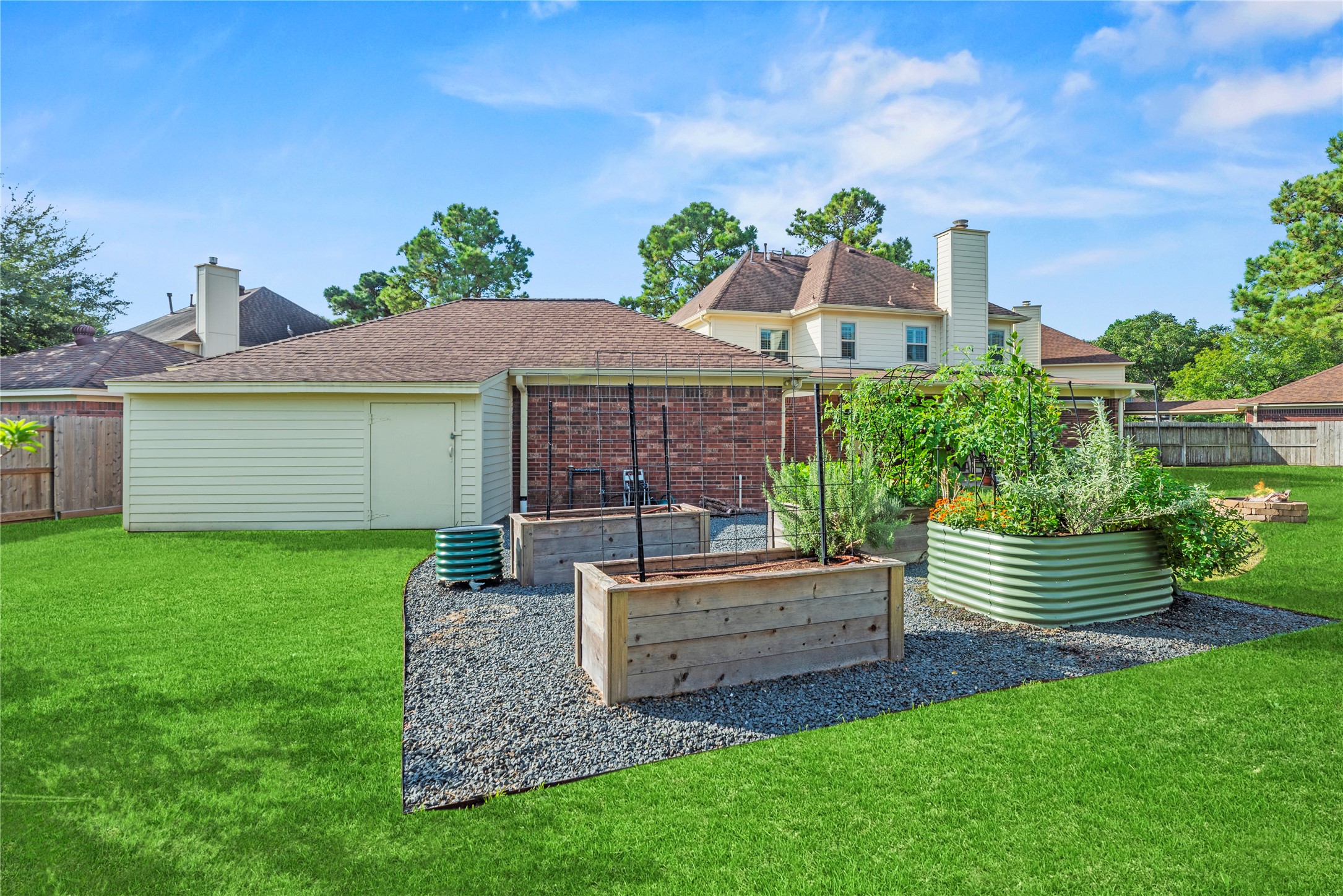 Dedicated gardening area with raised planting beds, perfect for growing fresh vegetables, herbs and flowers.