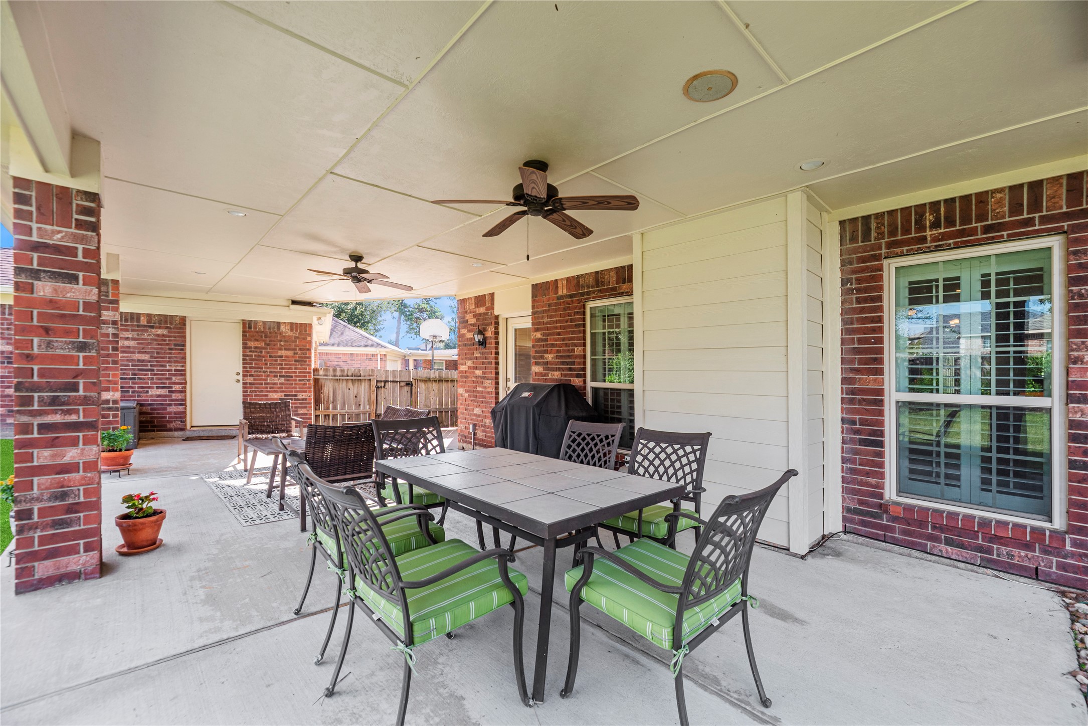 Expansive covered patio with ceiling fans.