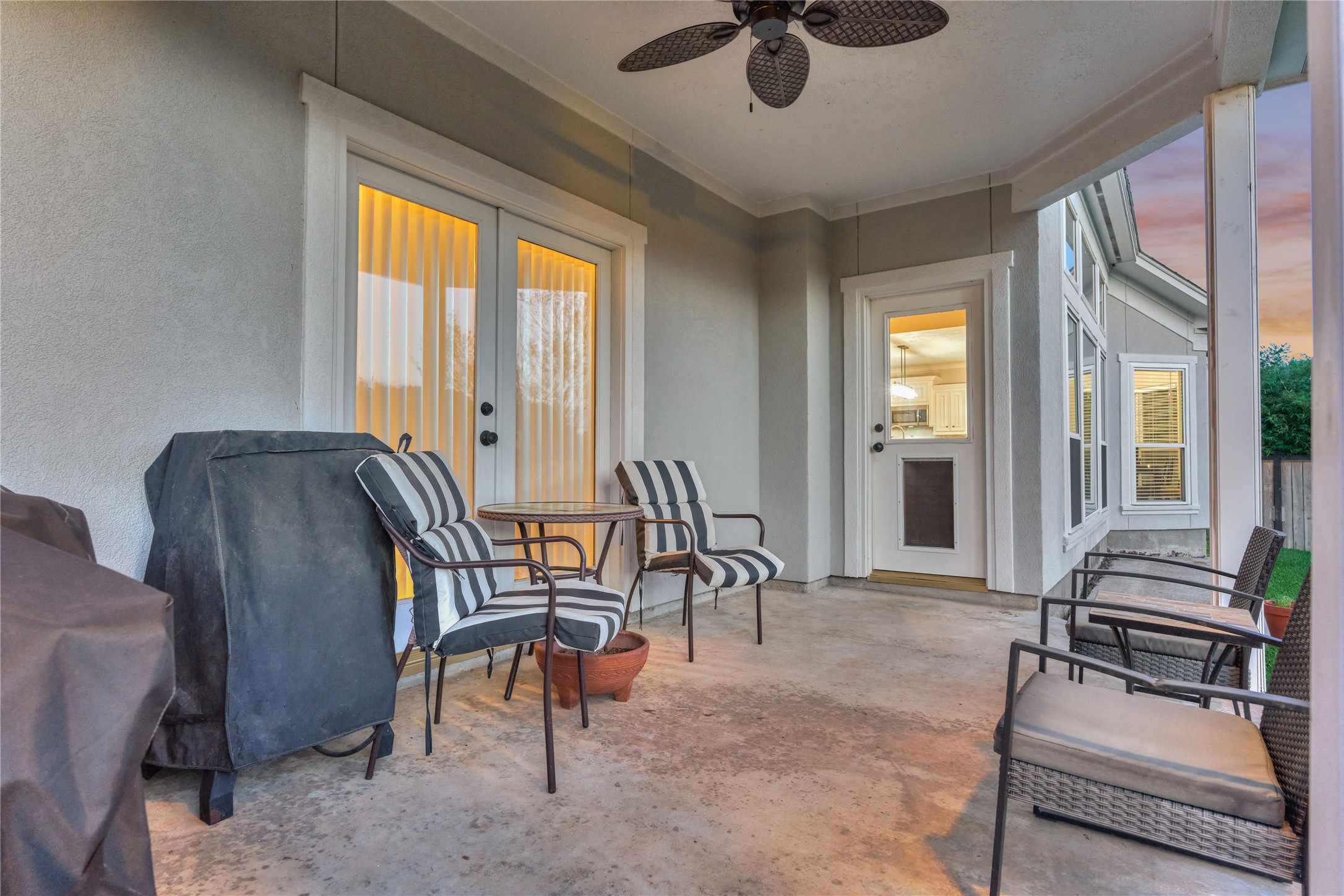 Access from the living room and the owners retreat creates a seamless connection to the patio and backyard for effortless indoor-outdoor living.