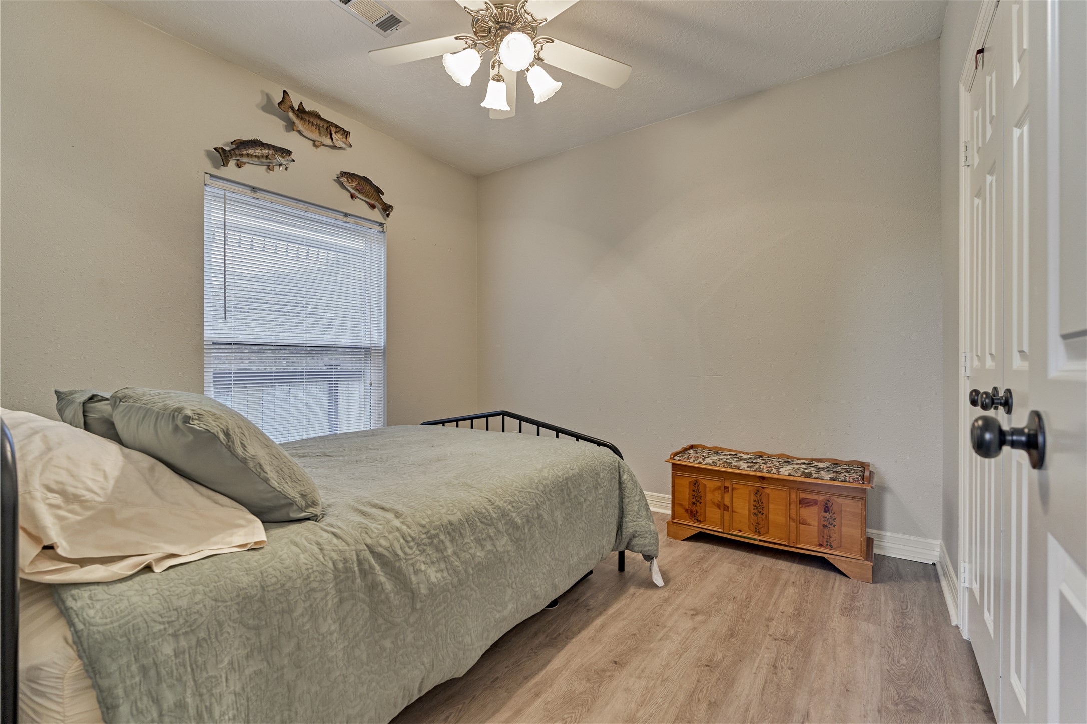Secondary bedroom #2 with updated flooring.