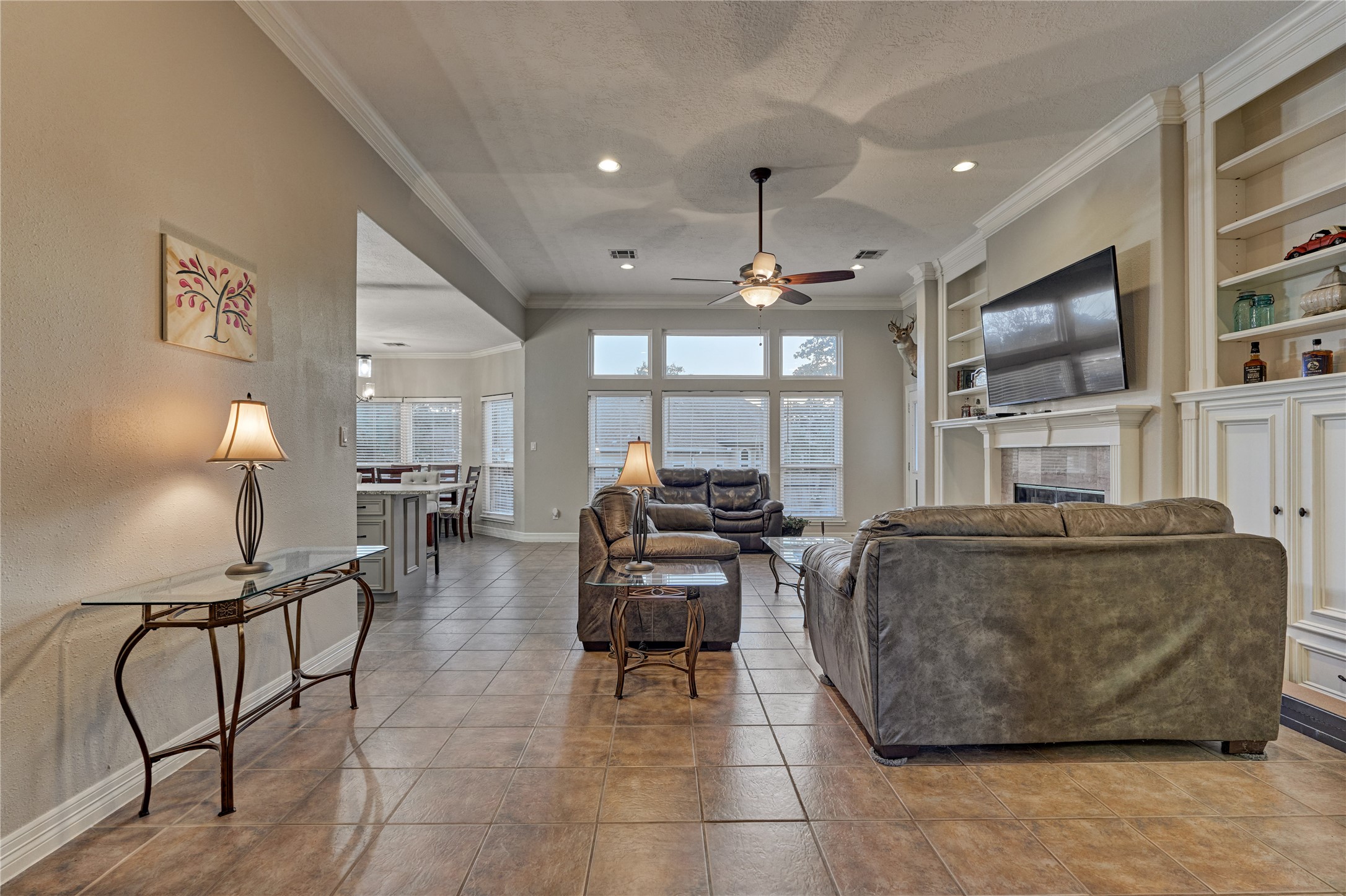 Step into an open-concept floor plan filled with natural light, where an abundance of windows creates a bright, airy, and welcoming atmosphere throughout the space.