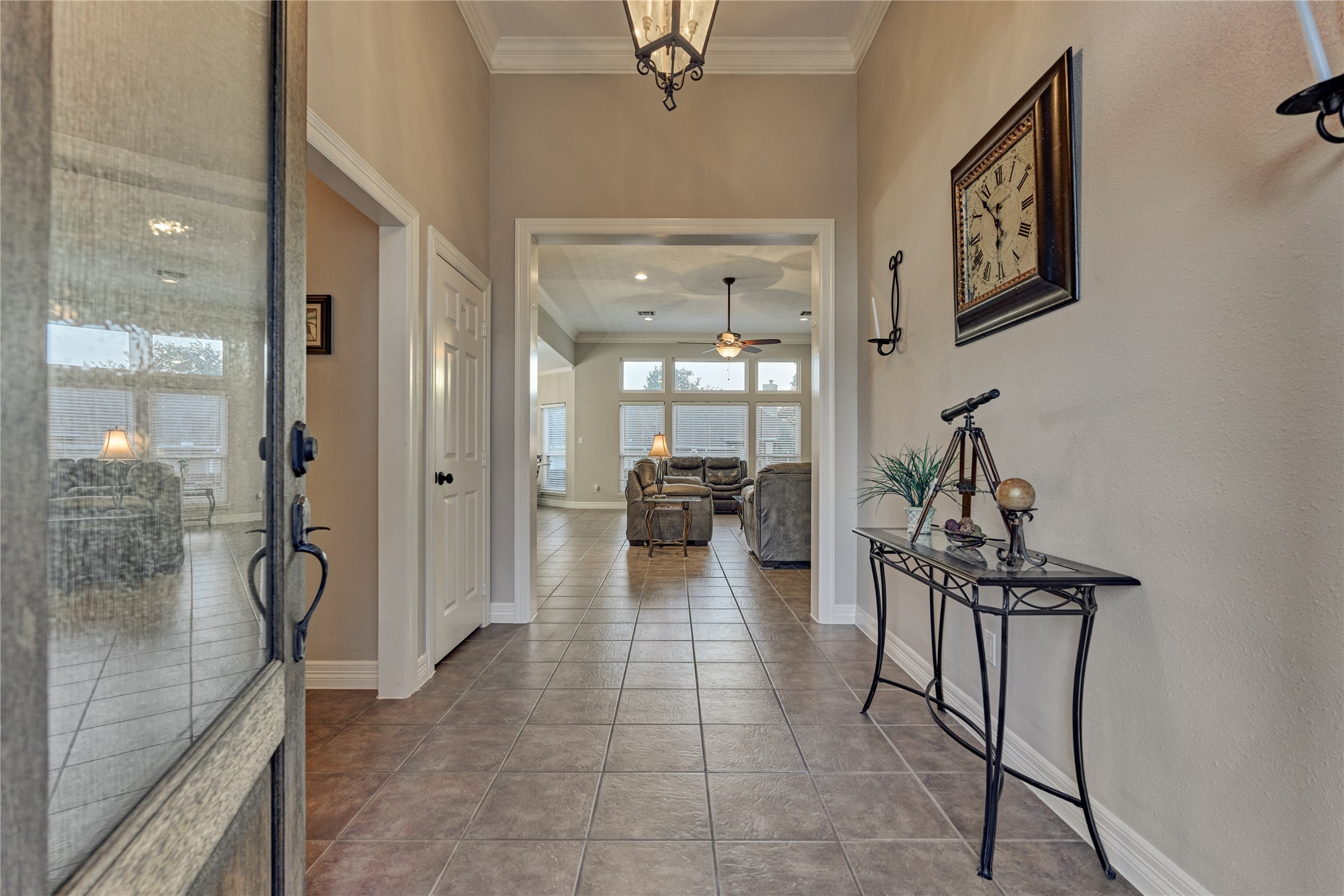 Spacious foyer with high ceilings and elegant crown molding sets the tone for this beautiful home.