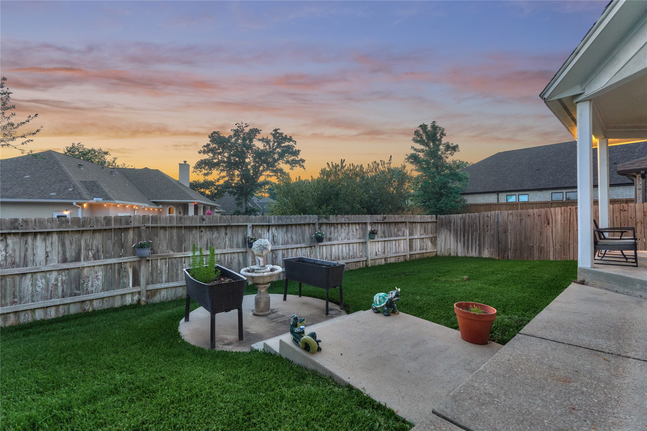 Versatile patio space ideal for outdoor entertaining, whether arranged as a comfortable sitting area, a grilling station, or a firepit gathering spot.