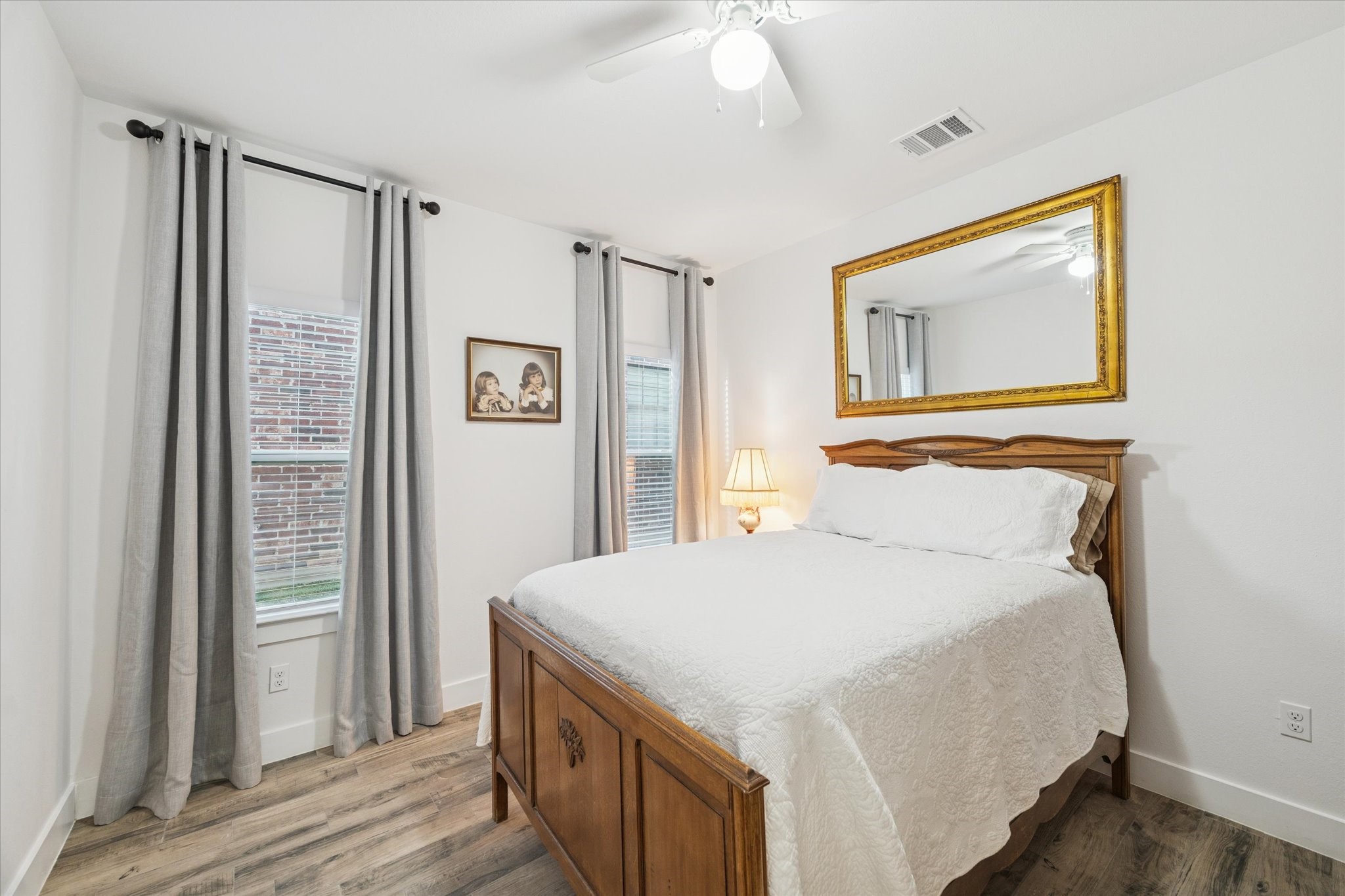 This secondary bedroom features abundant natural light, creating a peaceful and harmonious atmosphere. The spacious layout ensures comfort and privacy, making it an ideal retreat for family members or guests.