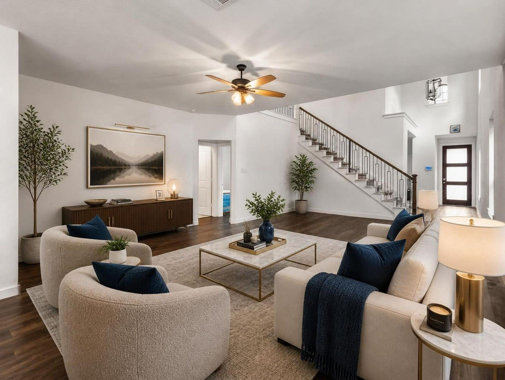 The living room opens with warm flooring, natural light, and a seamless connection to the kitchen. The space feels composed, open, and elevated. Virtually staged.