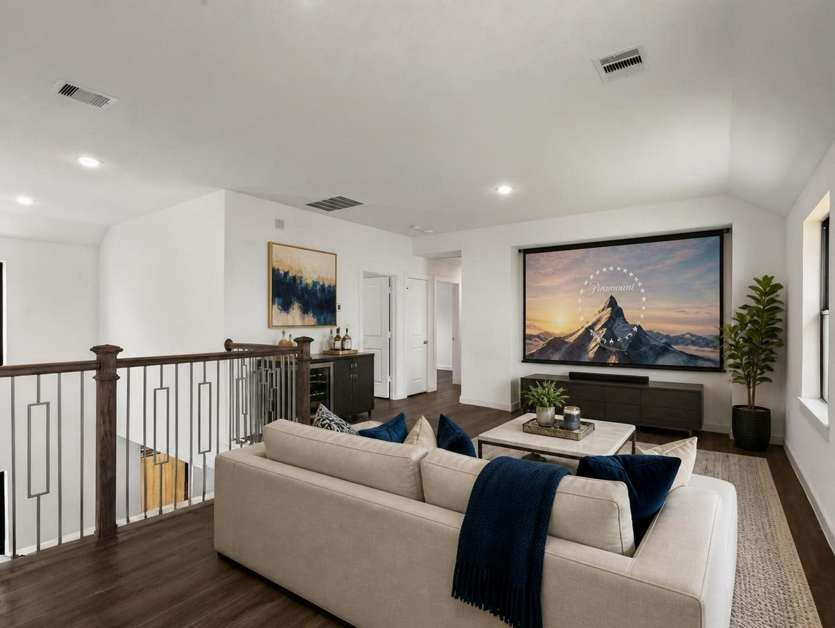The upstairs game room gives the home a second lounge space with clean lines and an open layout. A polished retreat for media, work, or downtime. Virtually staged.