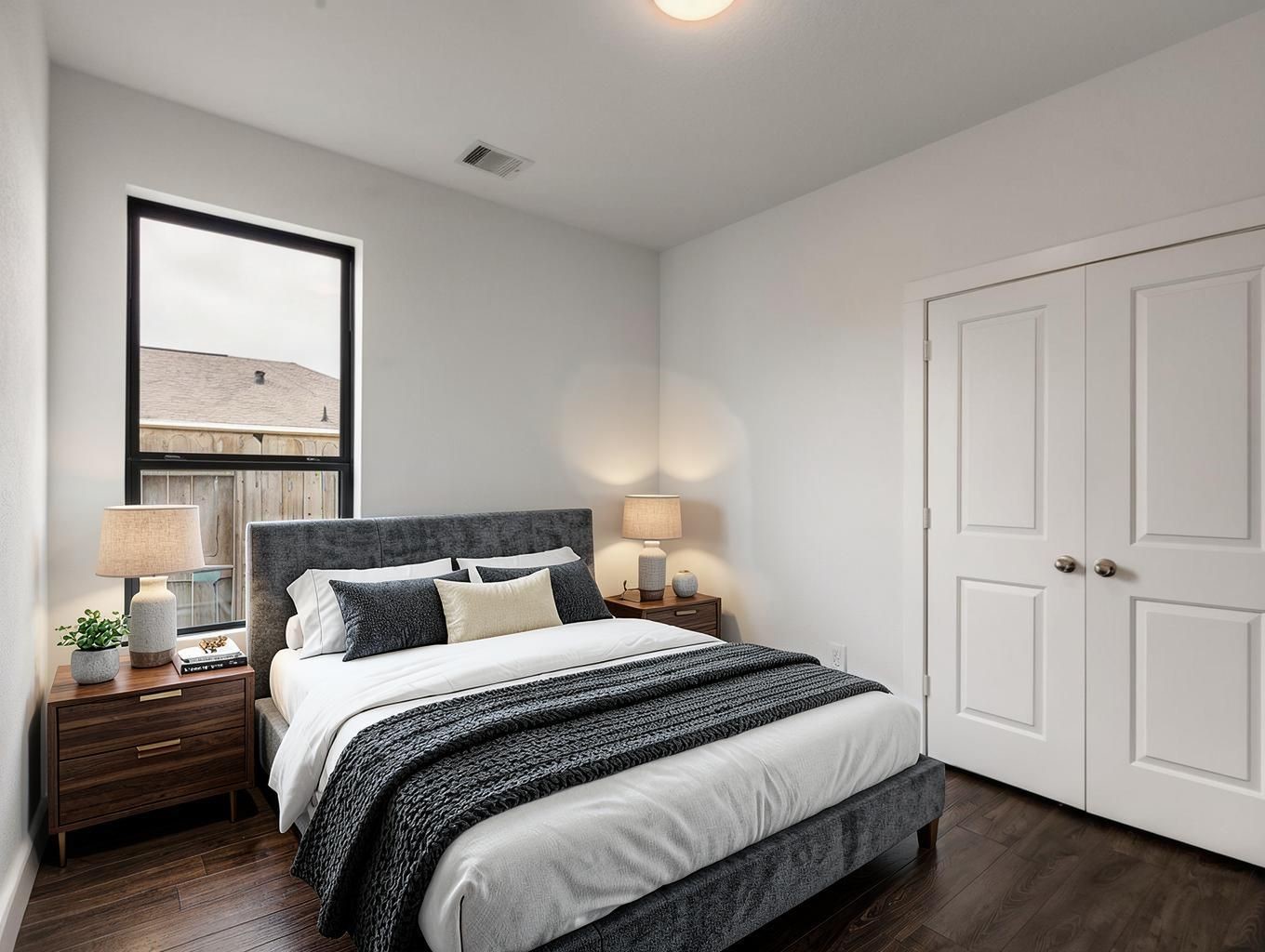 This bedroom feels calm and tailored with soft carpet, neutral walls, and a clean furniture setup. A private room with easy proportions. Virtually staged.