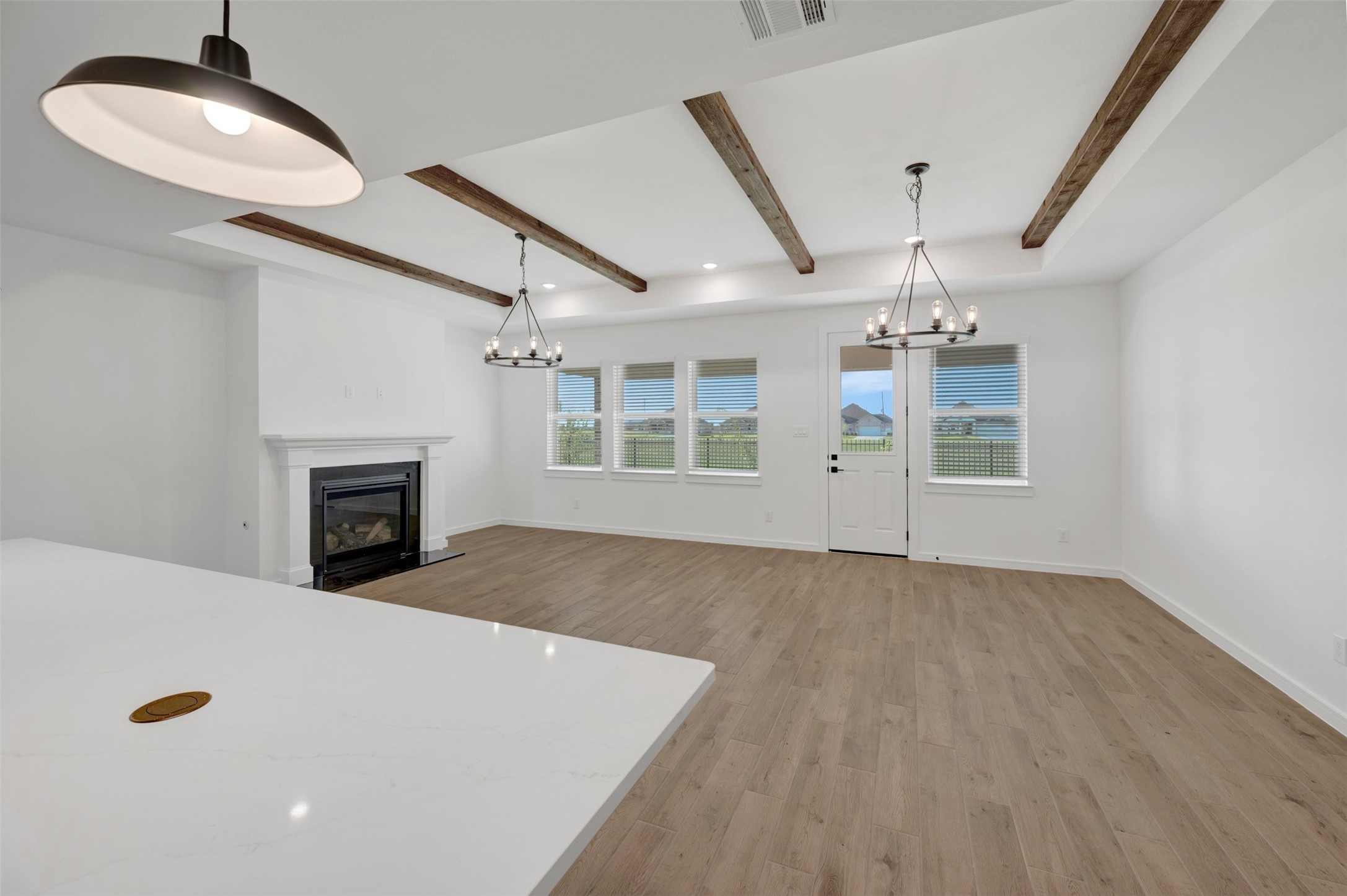 Kitchen overlooks the great room and dining area