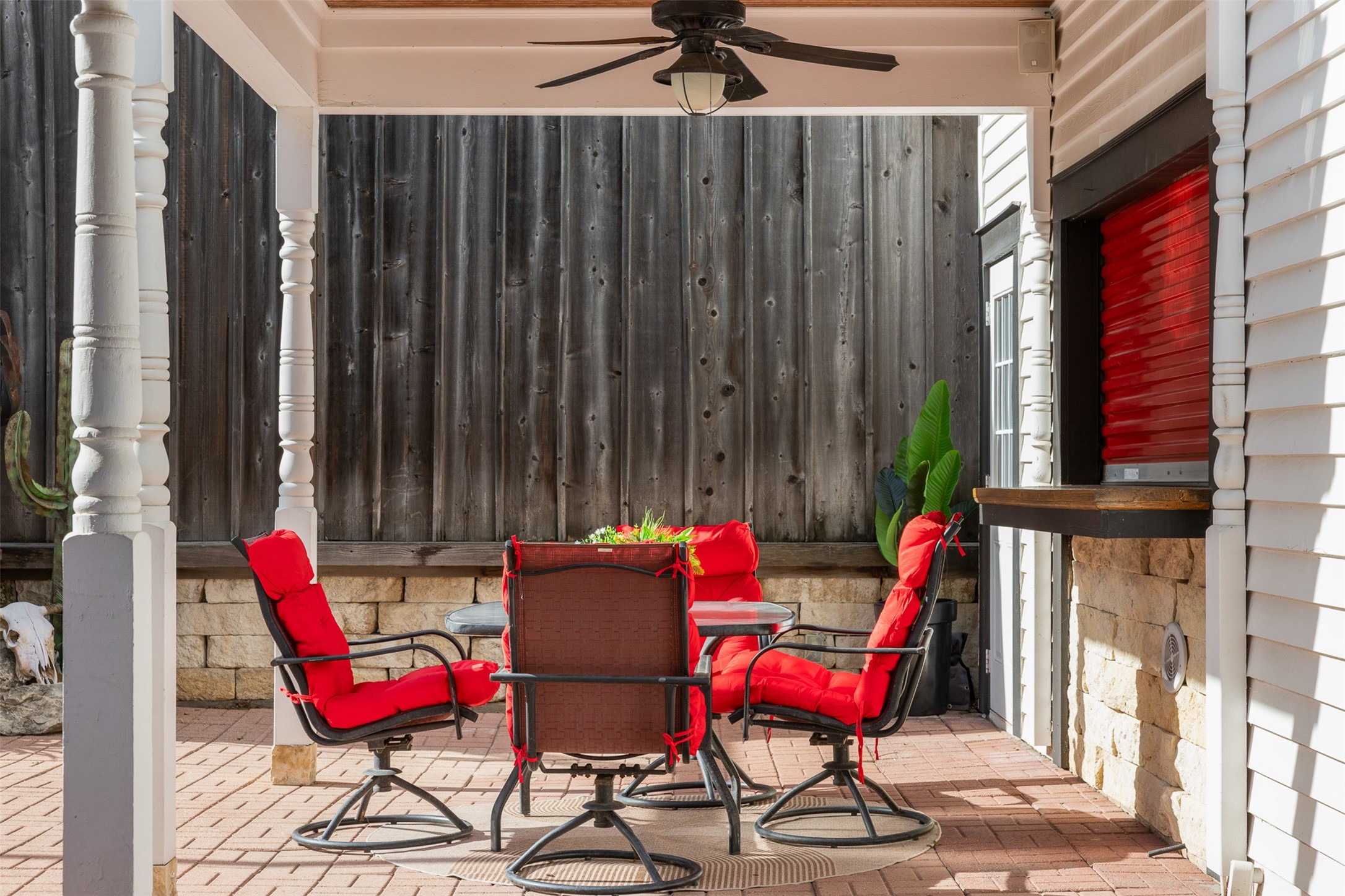 A covered outdoor sitting area offers a private place to relax or entertain beside the pool.