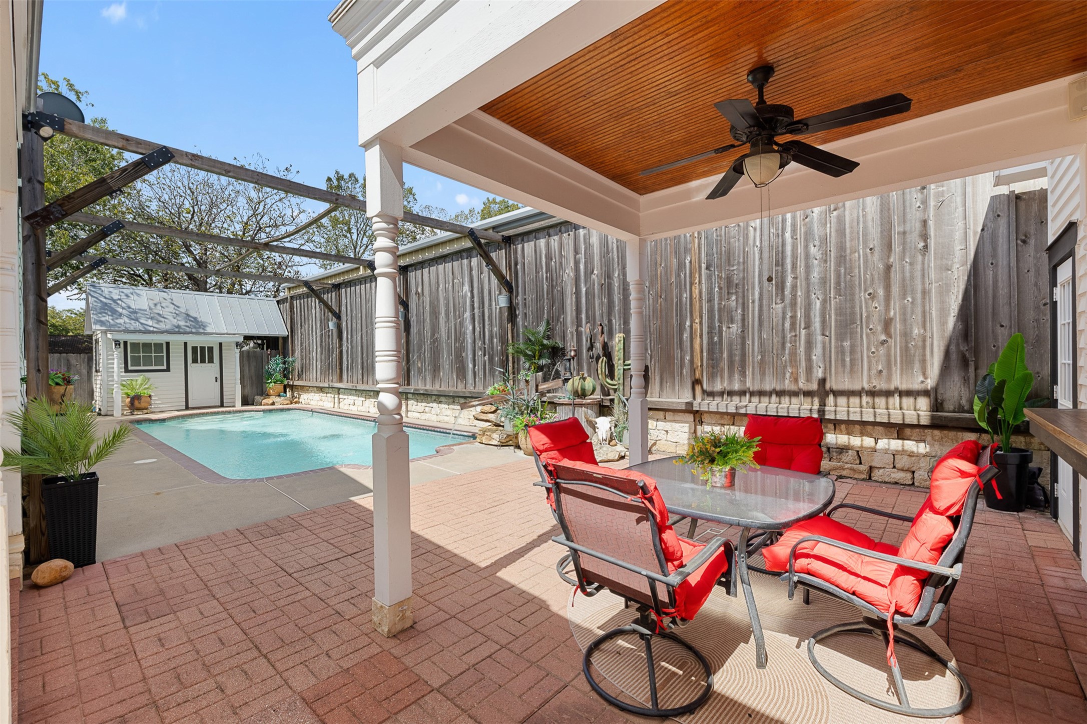 The shaded poolside patio is ready for leisurely afternoons, casual meals and warm Texas evenings.