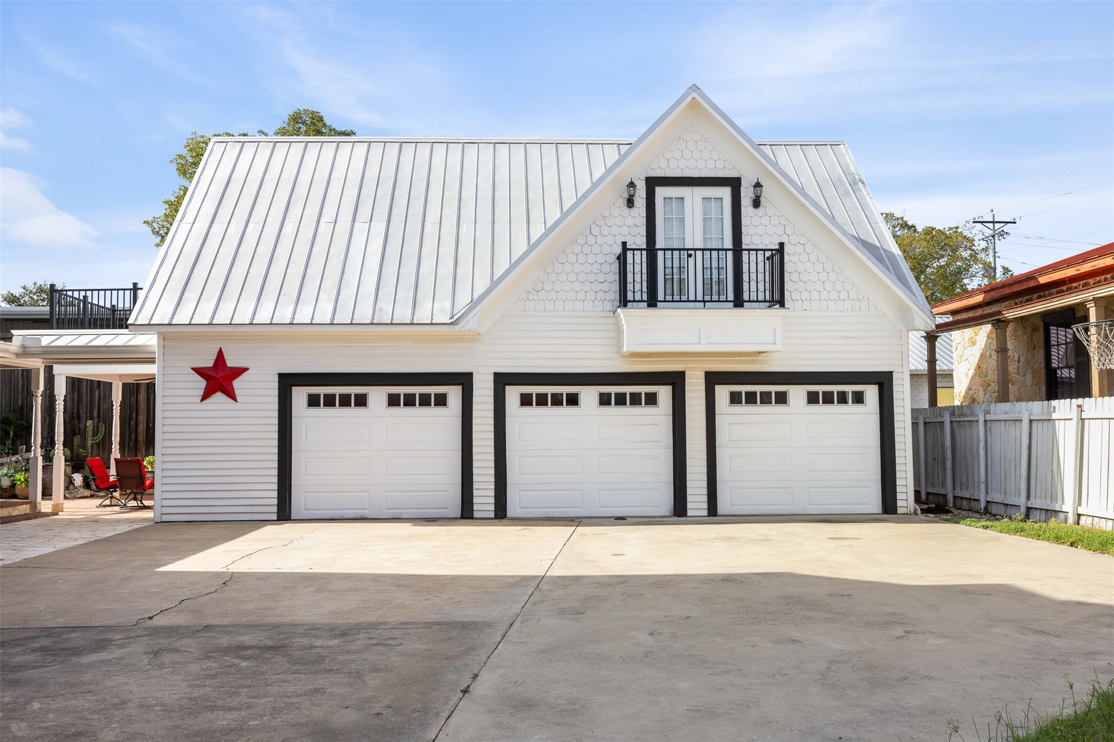 The oversized detached garage was designed to complement the architecture and character of the main residence.