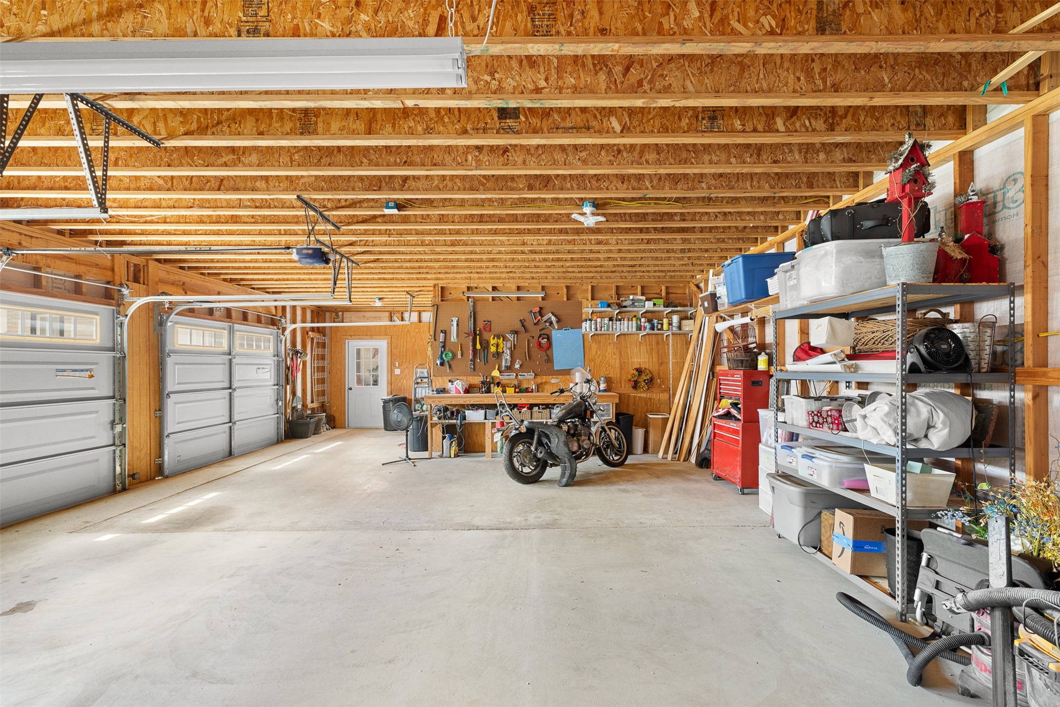 The expansive 2.5-car garage provides exceptional space for vehicles, storage, hobbies or a workshop.