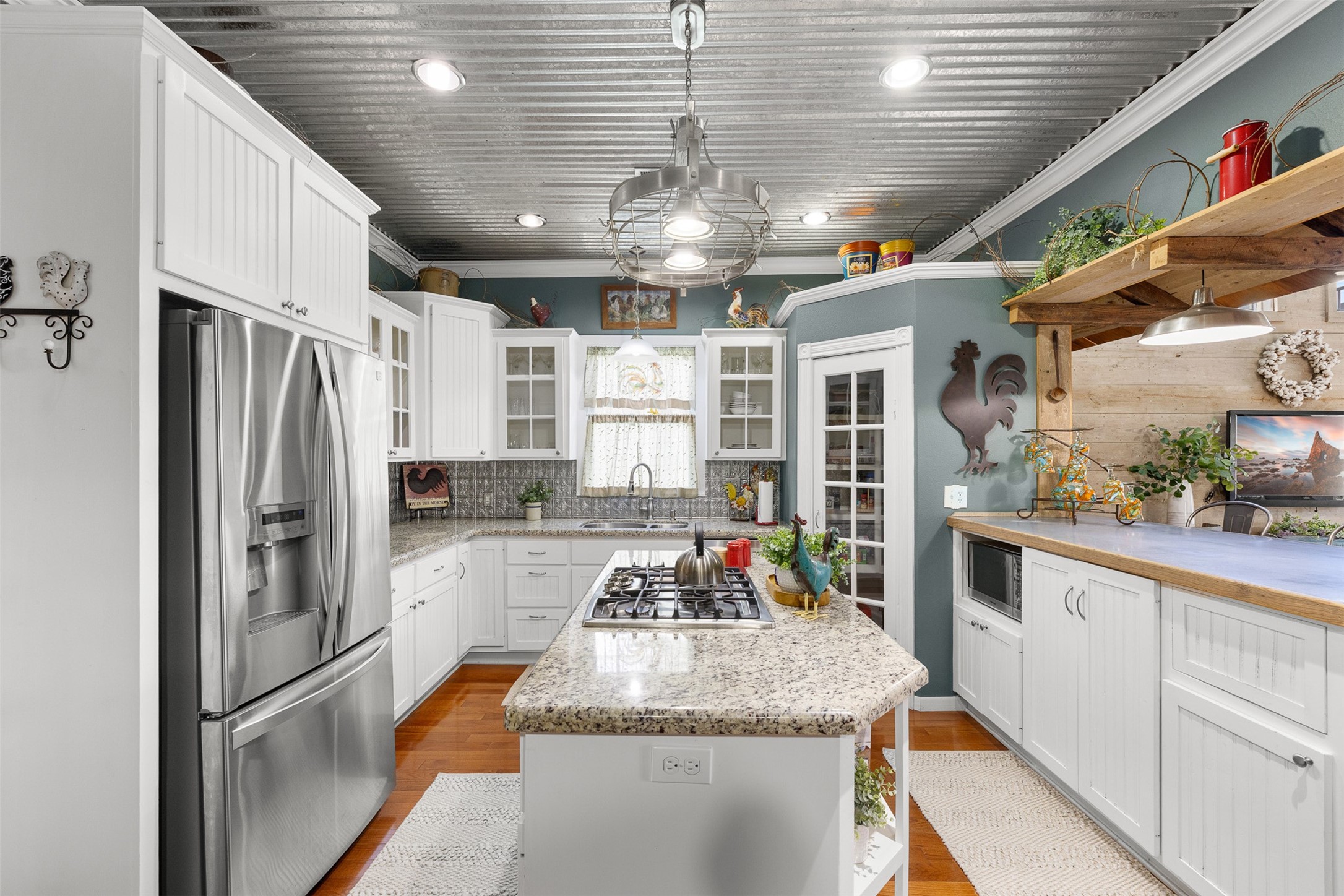 The updated kitchen combines granite countertops, stainless appliances and generous cabinetry.