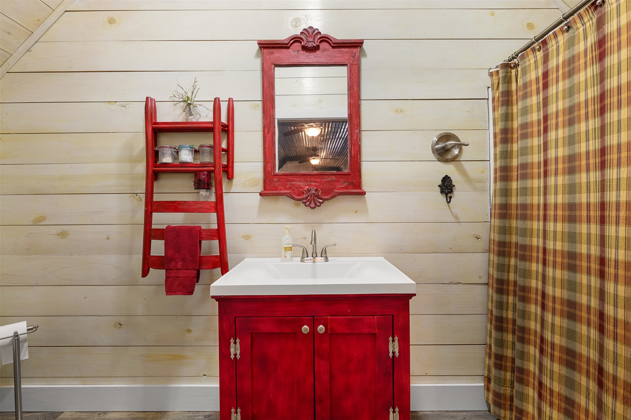 A full bath completes the garage apartment, adding comfort and versatility to the separate living space.