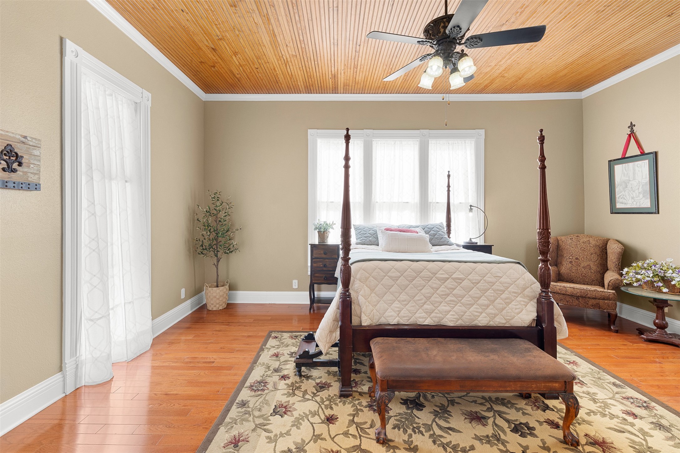 Generous proportions, natural light and a private fireplace give the primary bedroom an inviting sense of comfort.