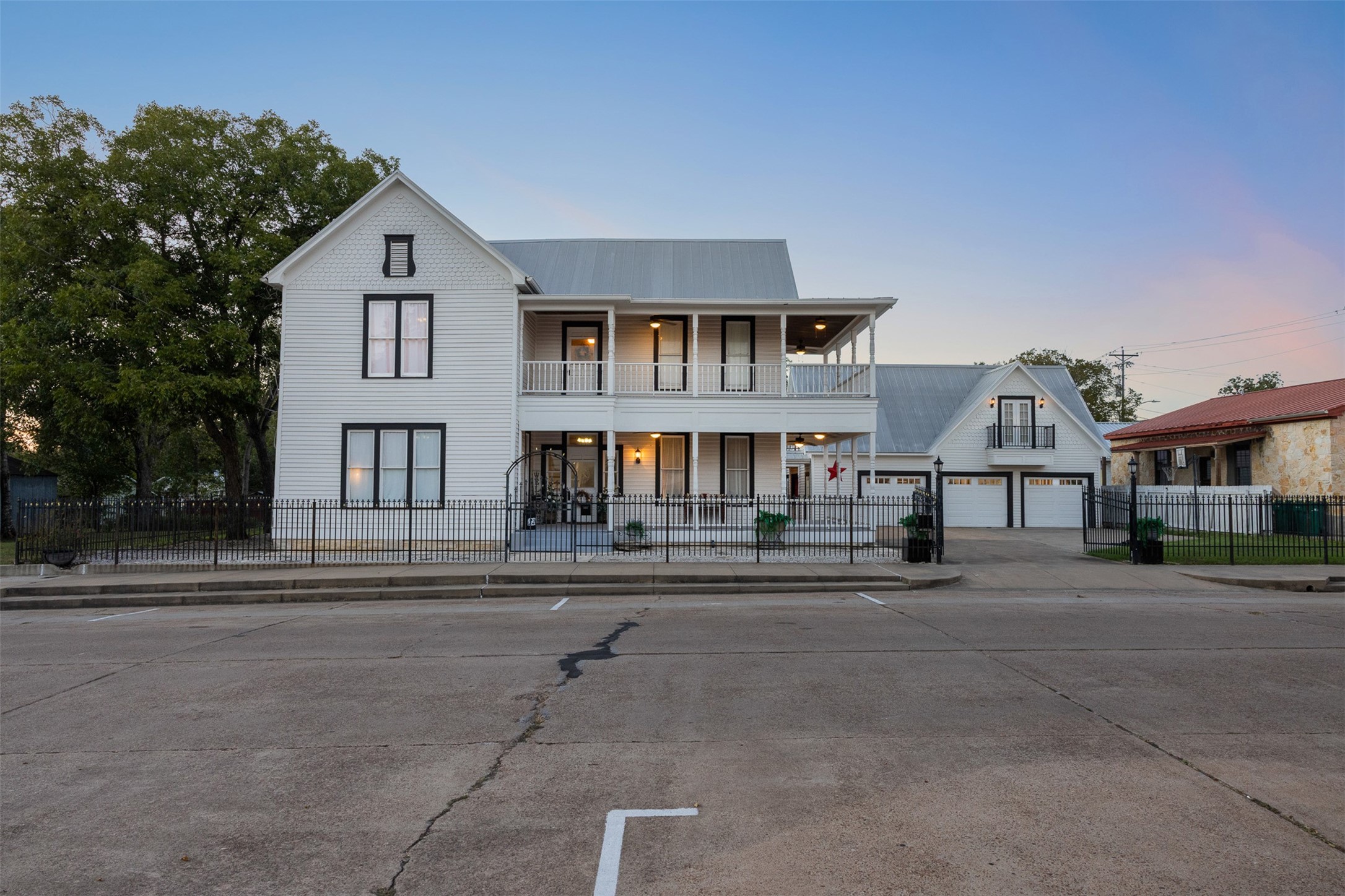 A beautiful twilight view captures the grace, history and unmistakable presence of 326 W Colorado Street.