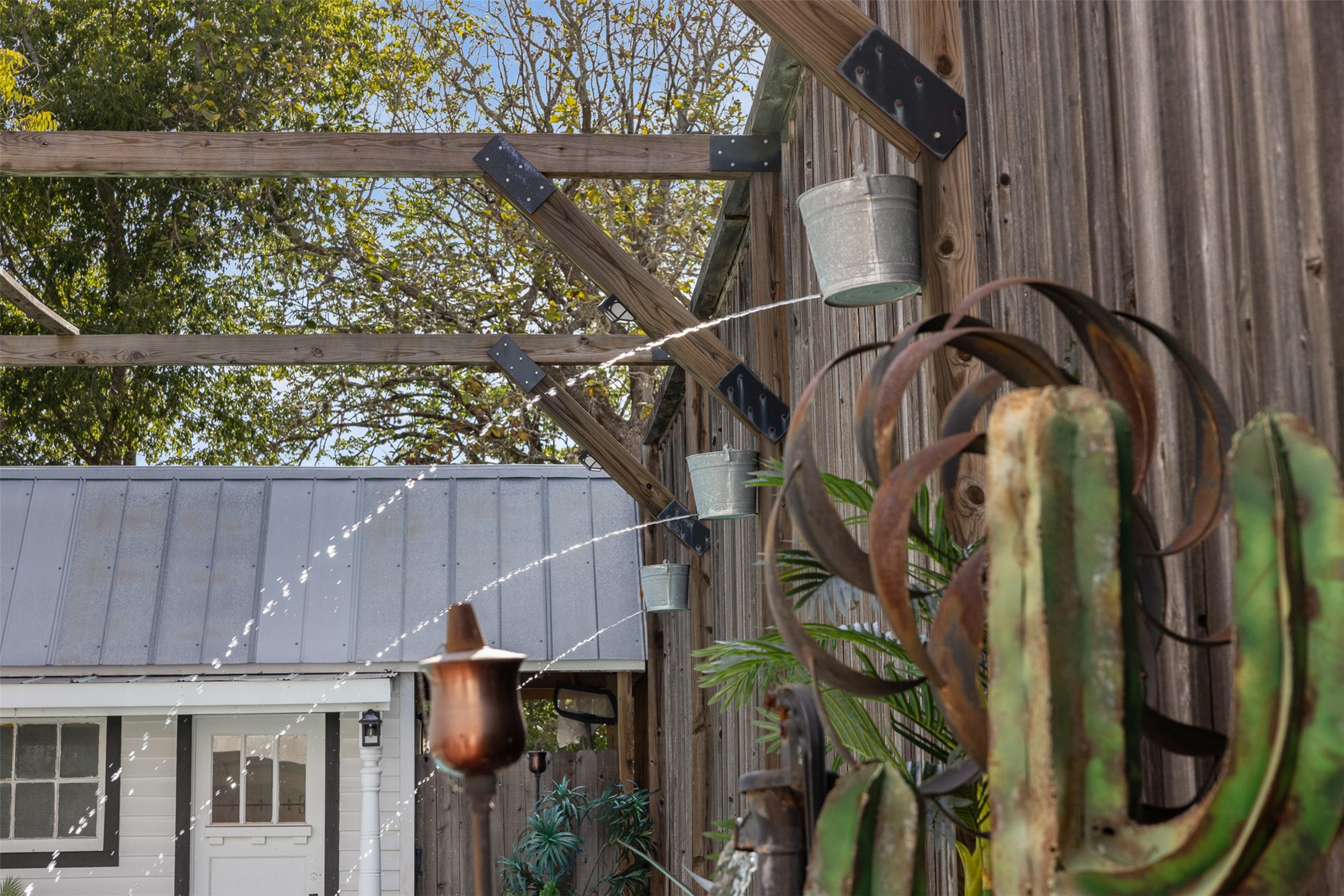 Landscaping and water features bring personality and charm to the private backyard setting.