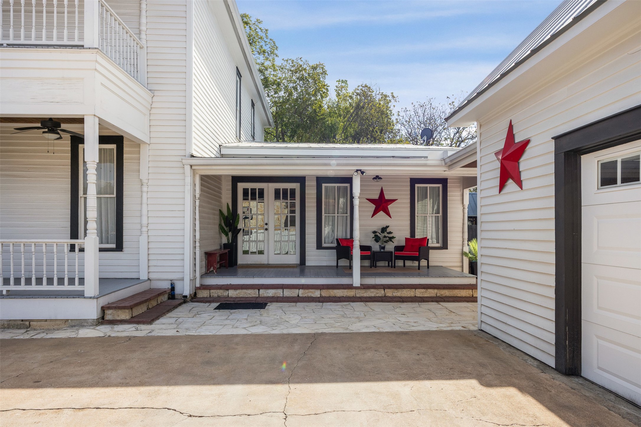The courtyard creates a charming connection between the historic residence and detached garage apartment.