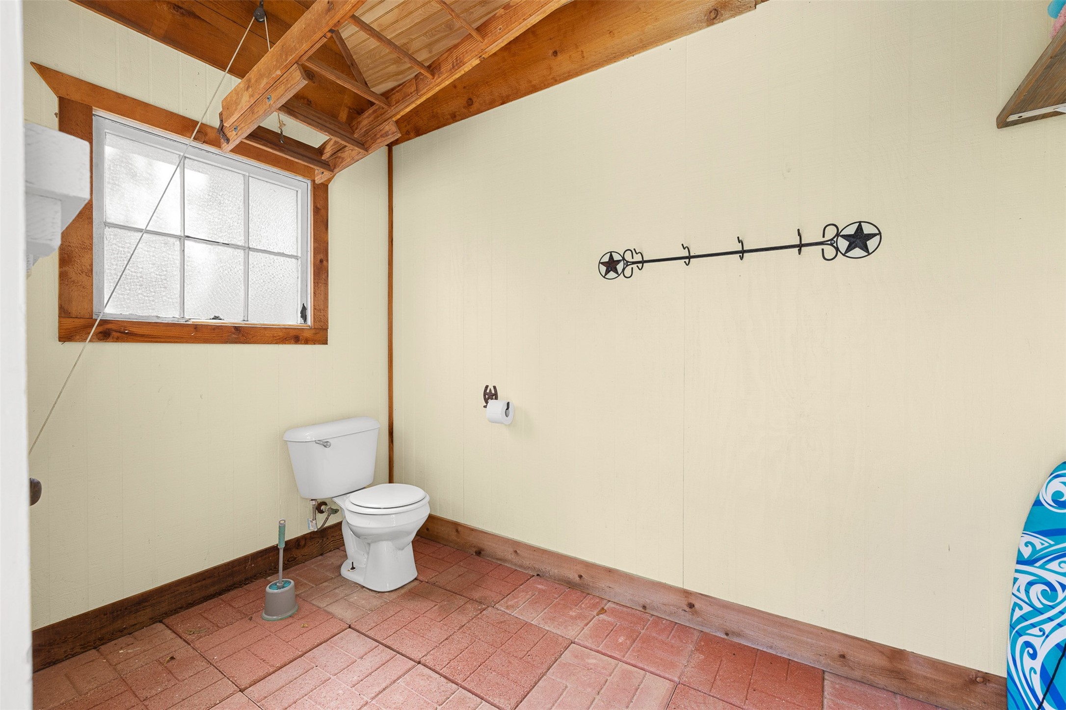 A convenient pool house restroom keeps swimmers and outdoor guests close to the fun.