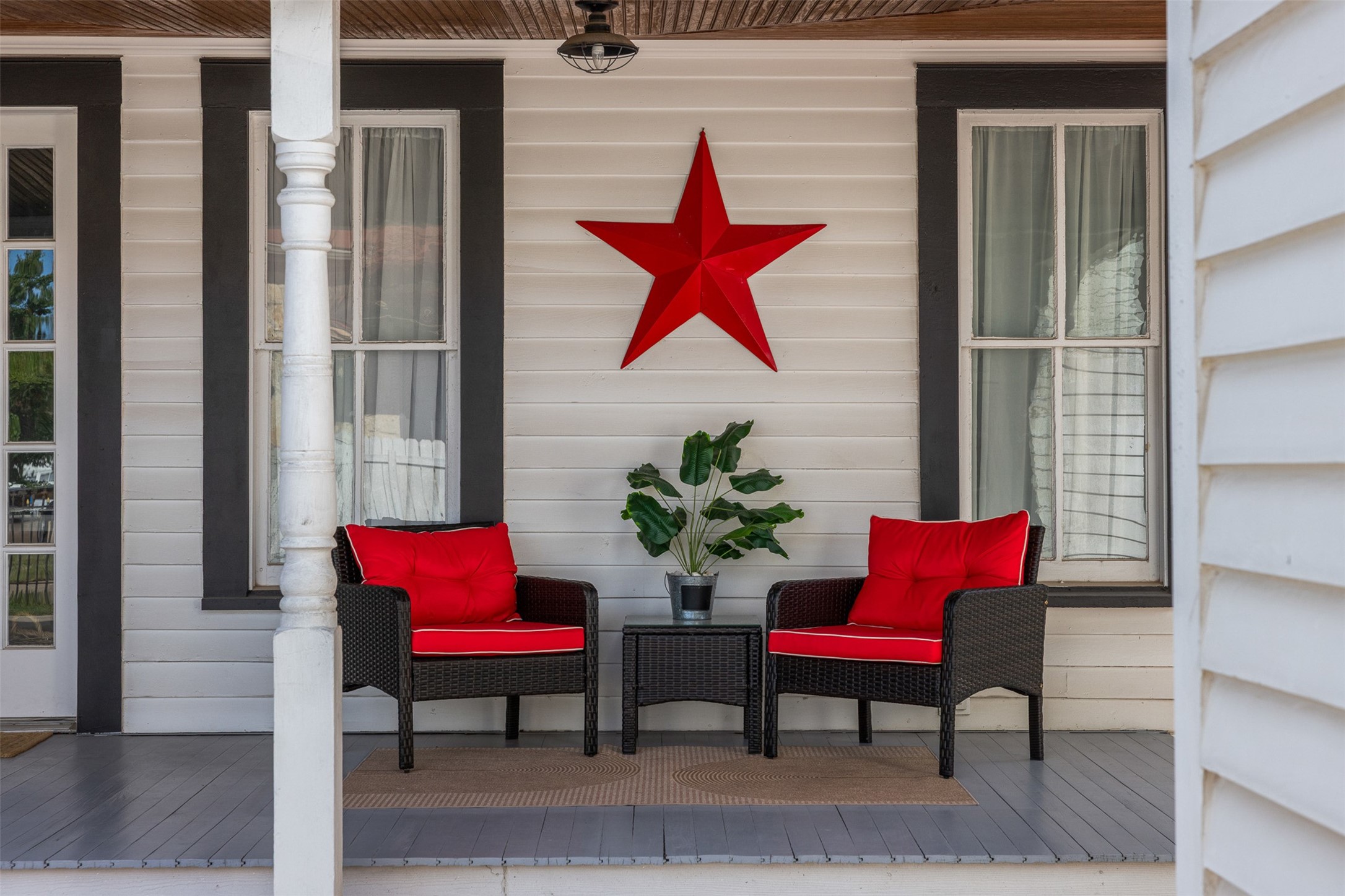A welcoming porch sitting area invites morning coffee, afternoon conversation and a slower pace of life.