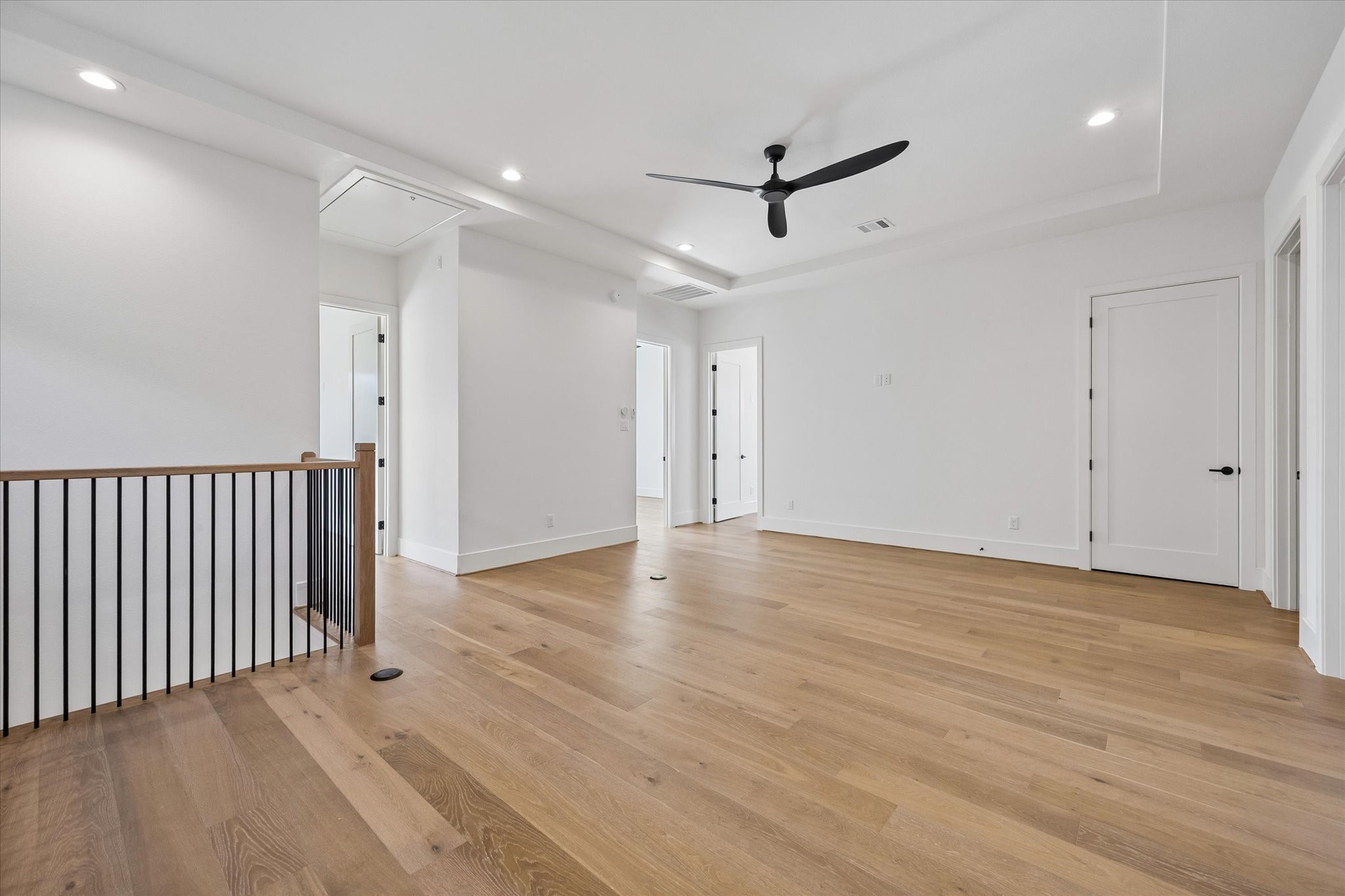 Upstairs, a spacious landing area/lof space creates a second living area with room for play or casual entertaining. Its central placement connects the surrounding bedrooms while keeping everyday gathering space separate from the main floor.