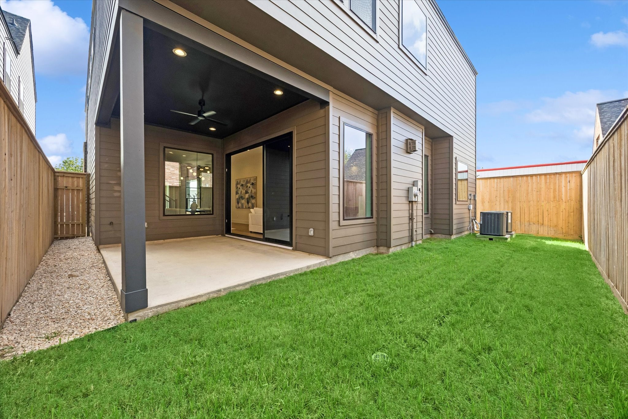 Fully fenced backyard offers green space for pets, play or entertaining, complemented by a covered patio for shaded outdoor living.
