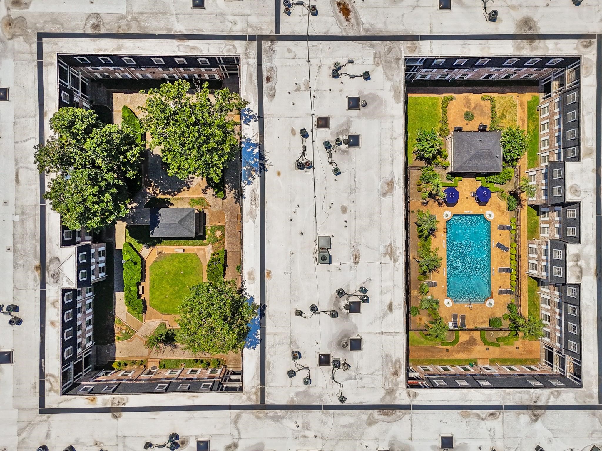 Stylish dual-courtyard complex featuring lush greenery and a sparkling pool, perfect for relaxation and entertainment.