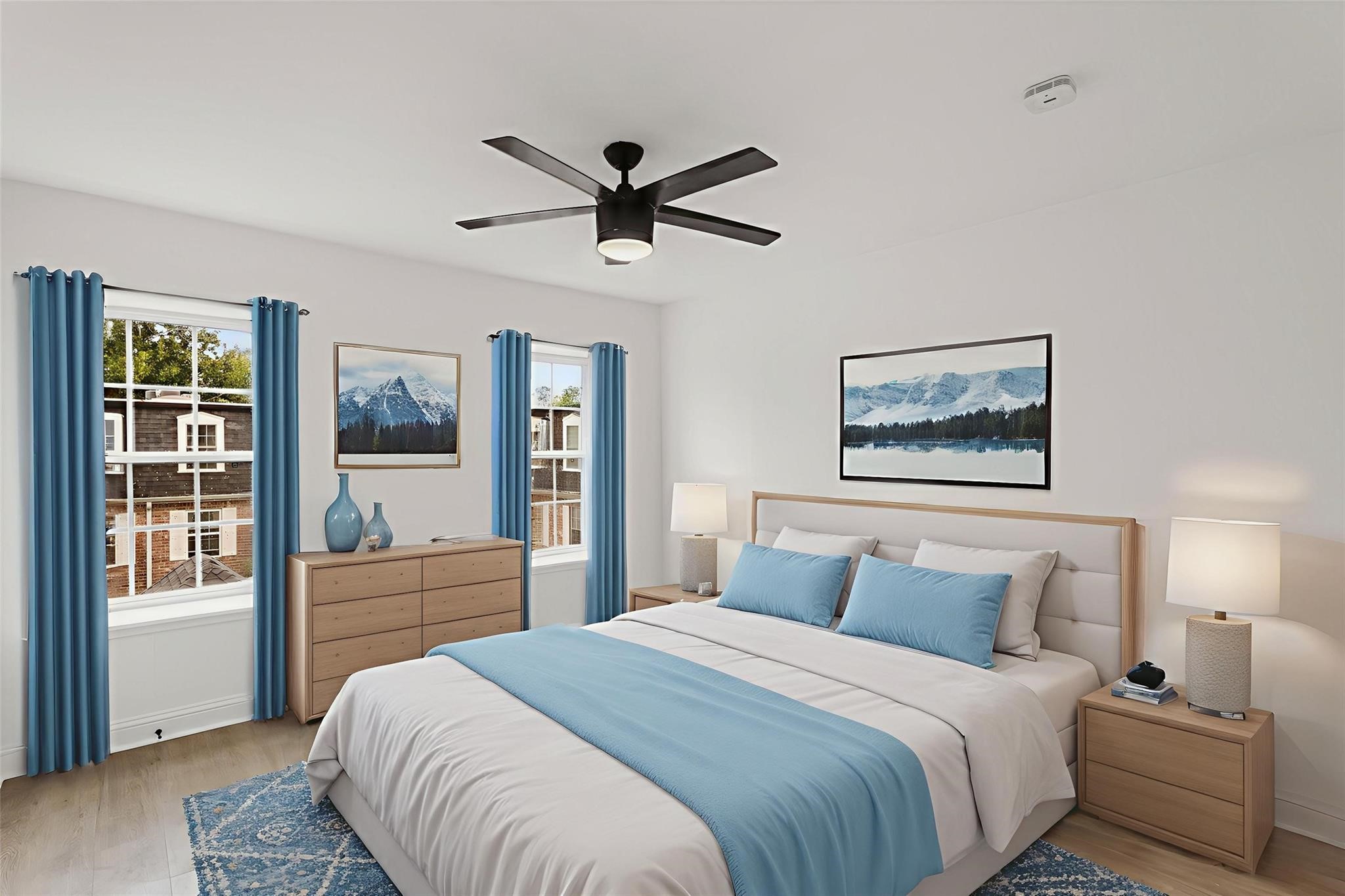 Bright and inviting bedroom with large windows, modern ceiling fan, and tasteful decor in soothing blue tones. Bright and inviting bedroom with large windows, modern ceiling fan, and tasteful decor in soothing blue tones.