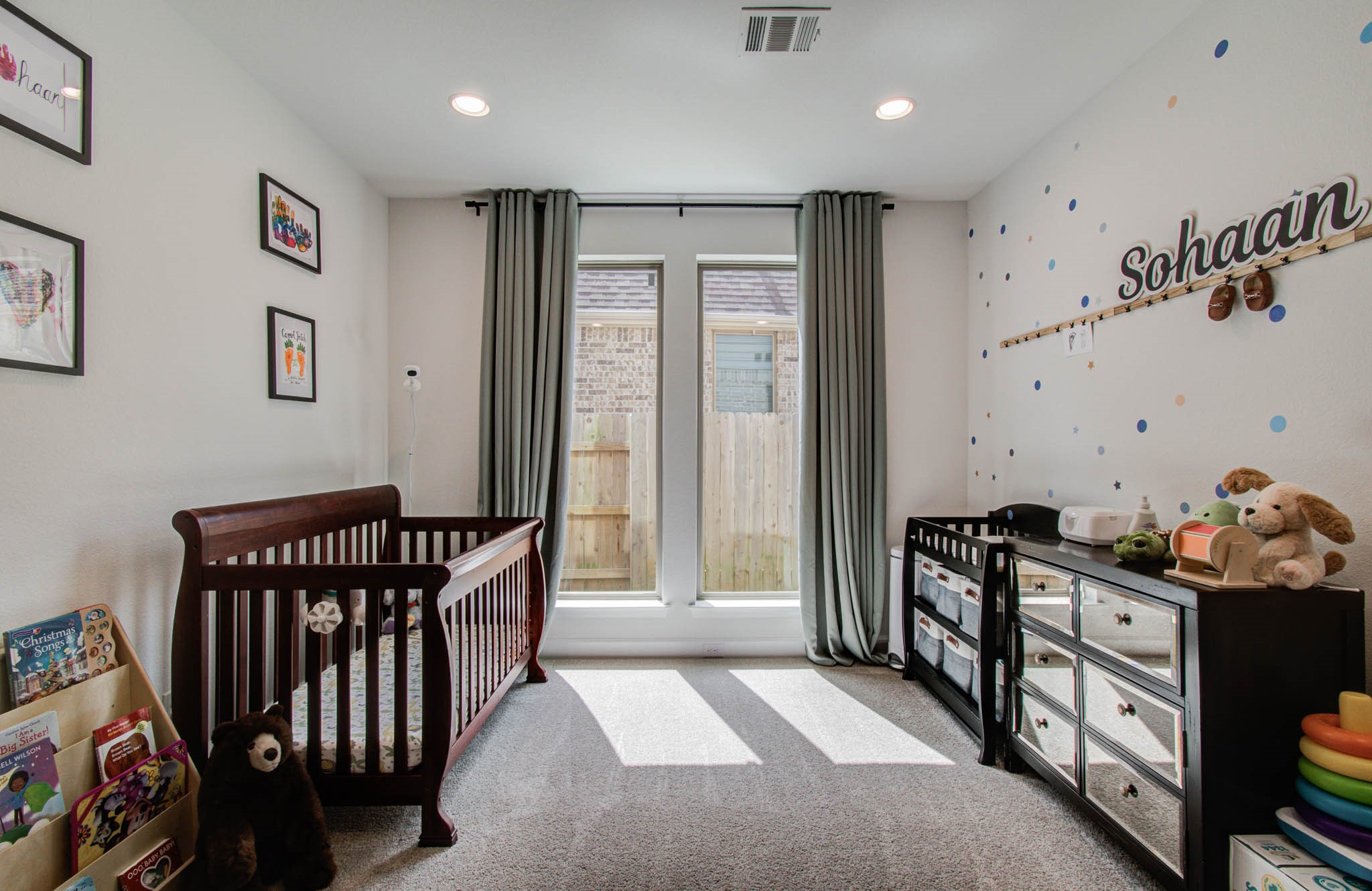 Cozy and convenient, this versatile office area has been thoughtfully transformed into a charming infant space, perfect for easy downstairs access.