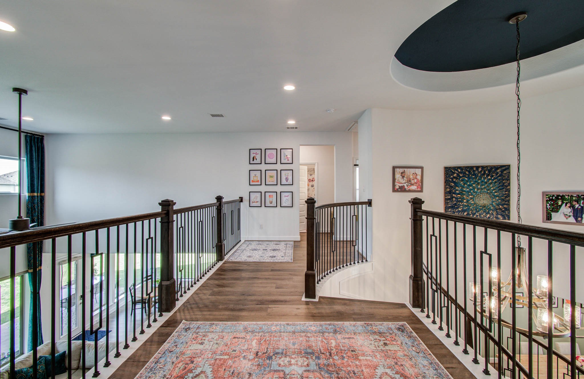 A stylish landing effortlessly separates the vibrant game room from the cozy bedrooms, offering both functionality and elegance.