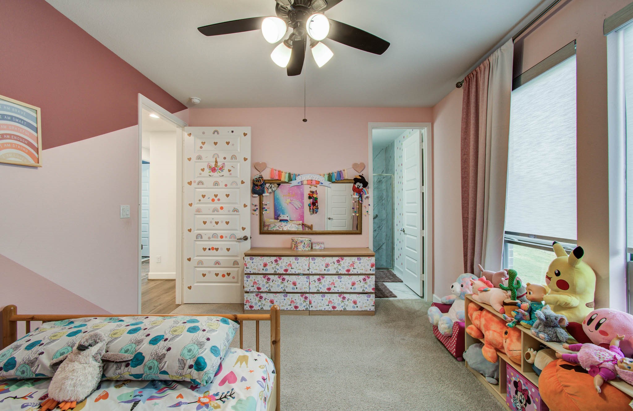 Downstairs bedroom with ceiling fan and ADA entry to the room.