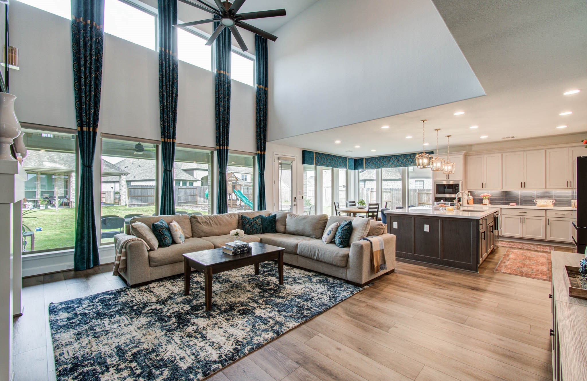 Experience modern elegance with luxury vinyl wide planks and electric roller shades enhancing this home's sophisticated ambiance.