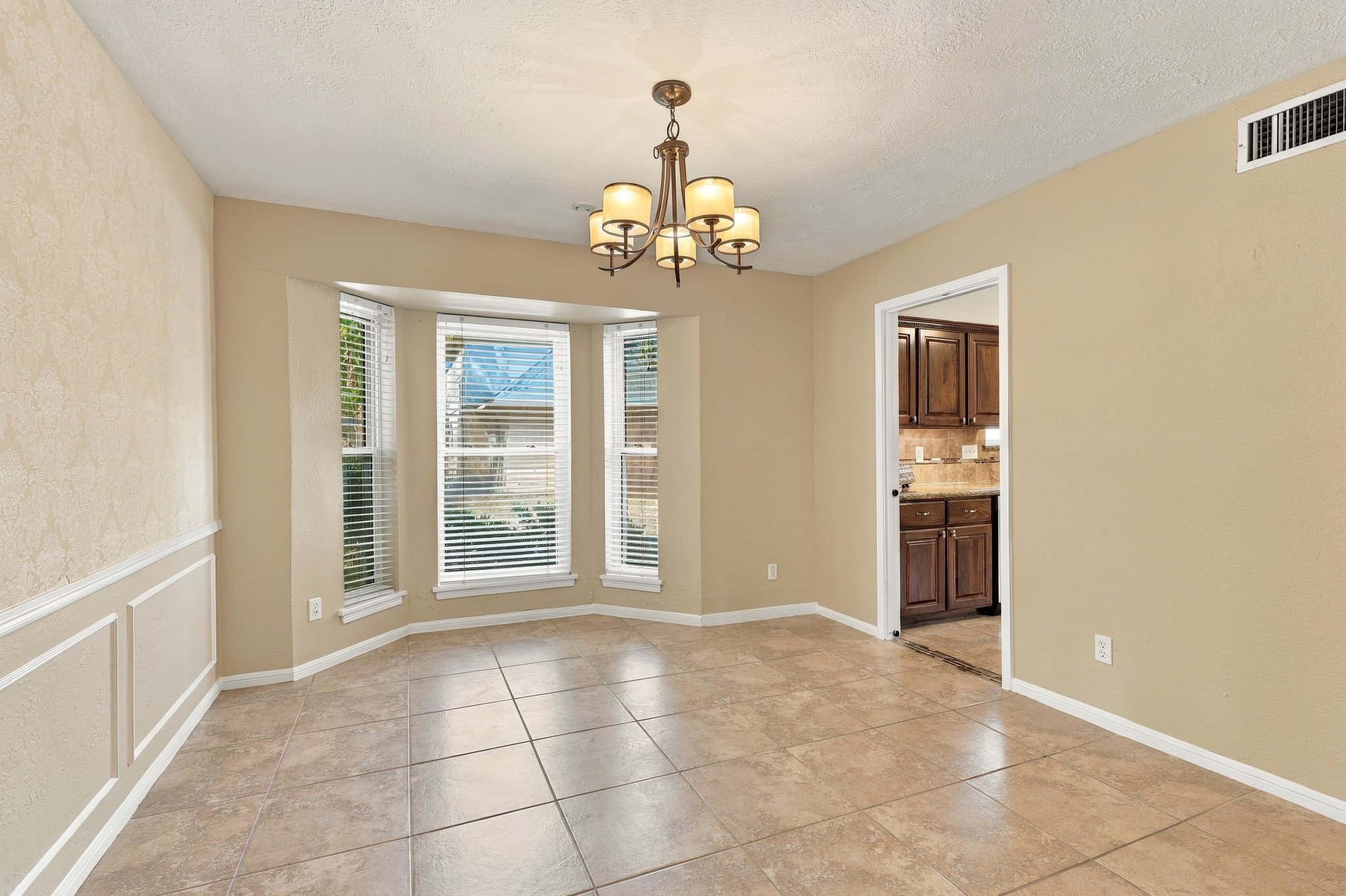 Right off of the Kitchen is the entrance right into the Dining Room