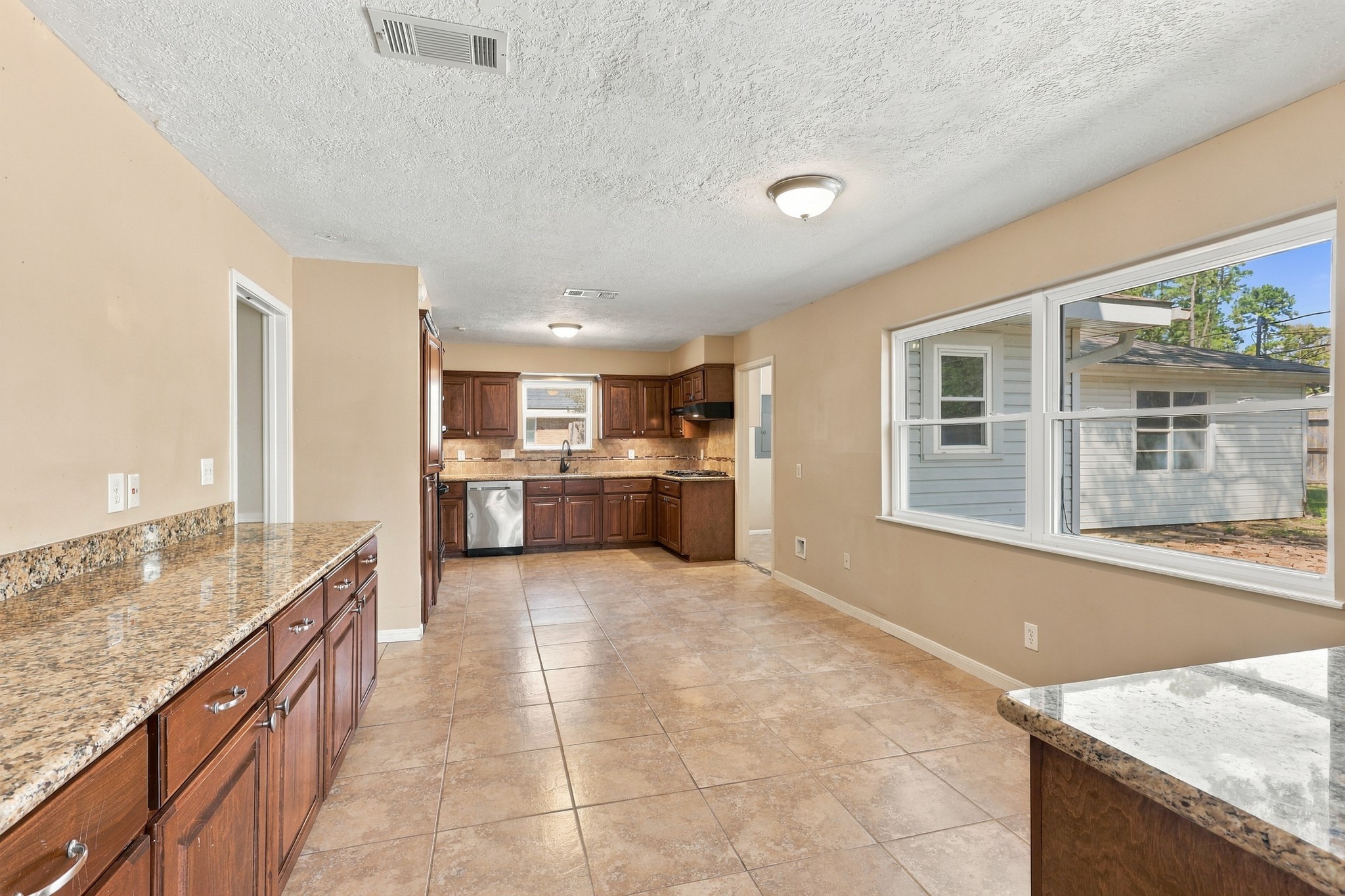 Kitchen introduces Brown cabinetry and Granite Countertops Kitchen introduces Brown cabinetry and Granite Countertops