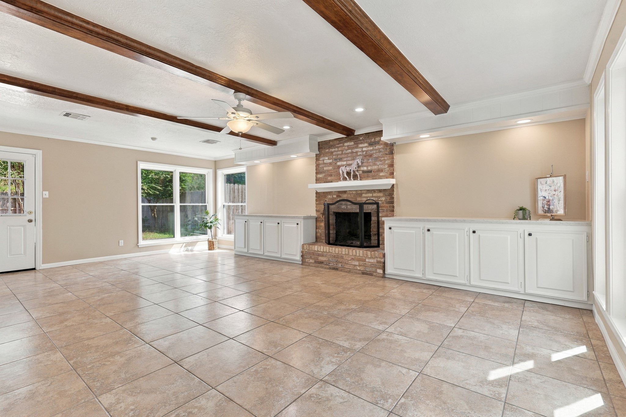 Upon Entrance you'll walk into the Living Room with Wooden Beams across the Ceiling also including new Quartz Countertops Upon Entrance you'll walk into the Living Room with Wooden Beams across the Ceiling also including new Quartz Countertops